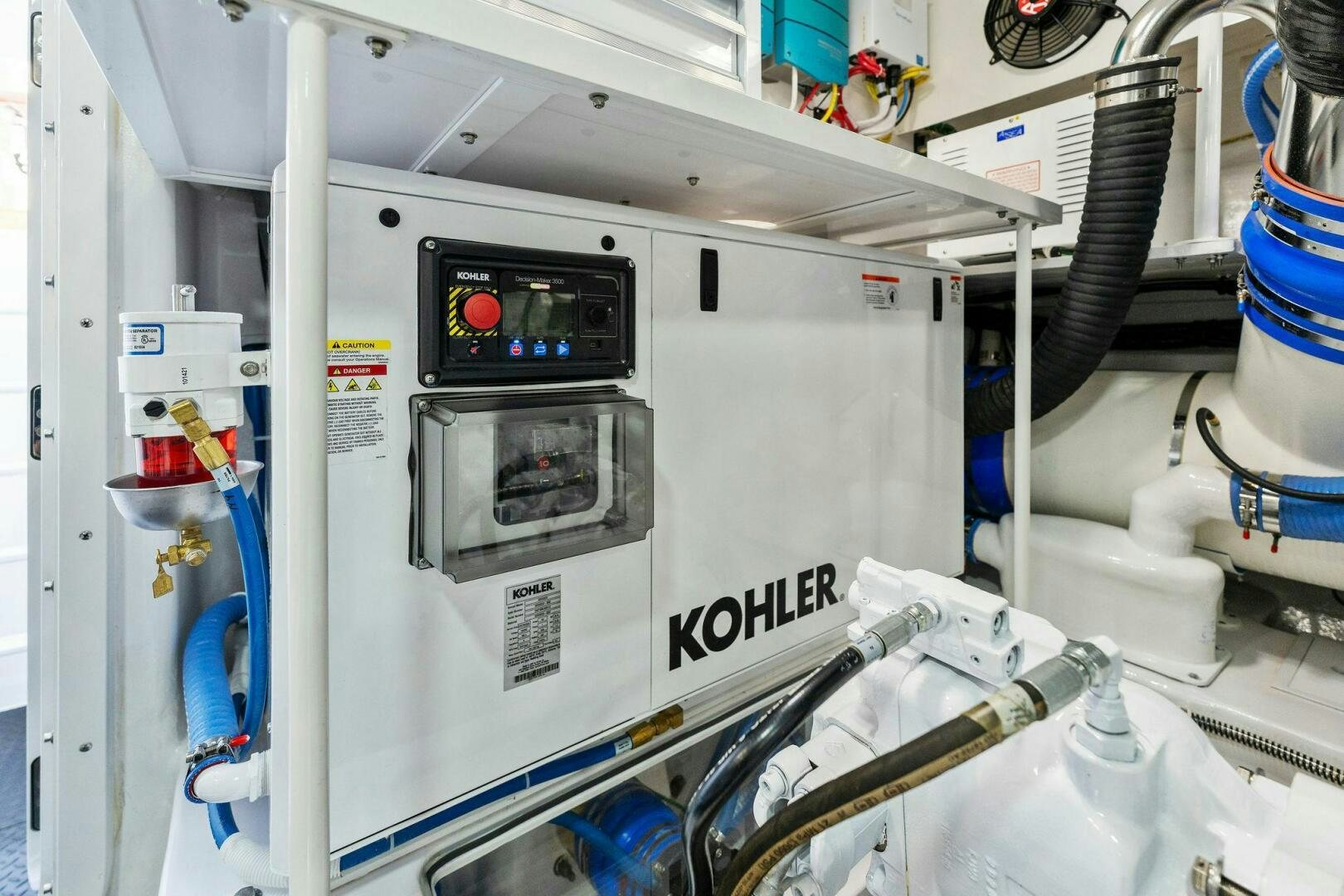 a white machine with a black label aboard SHOE  Yacht for Sale