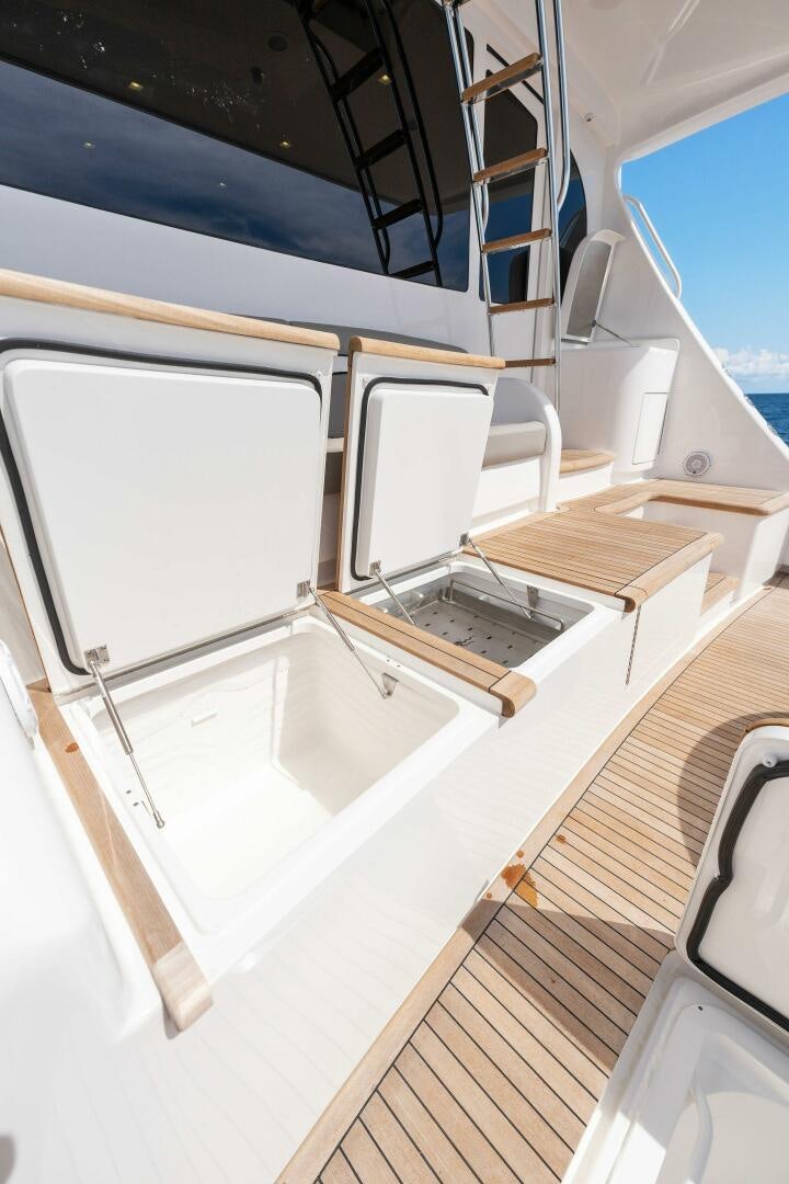 a white rectangular object on a wooden surface aboard SHOE  Yacht for Sale