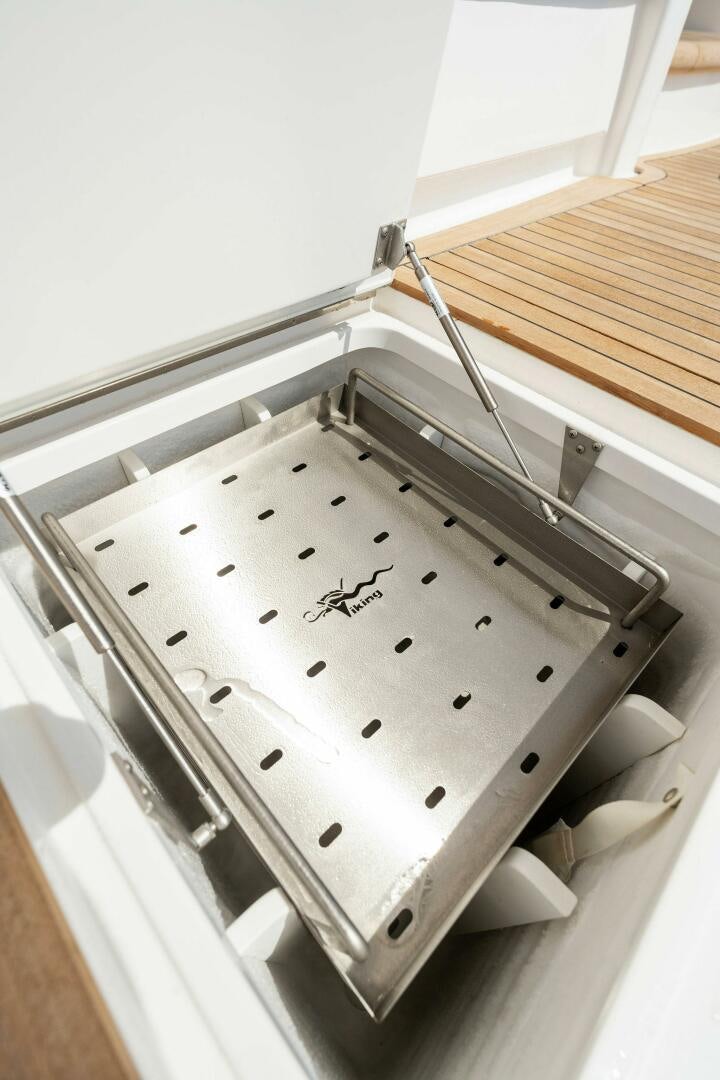 a white watch with black dots aboard SHOE  Yacht for Sale