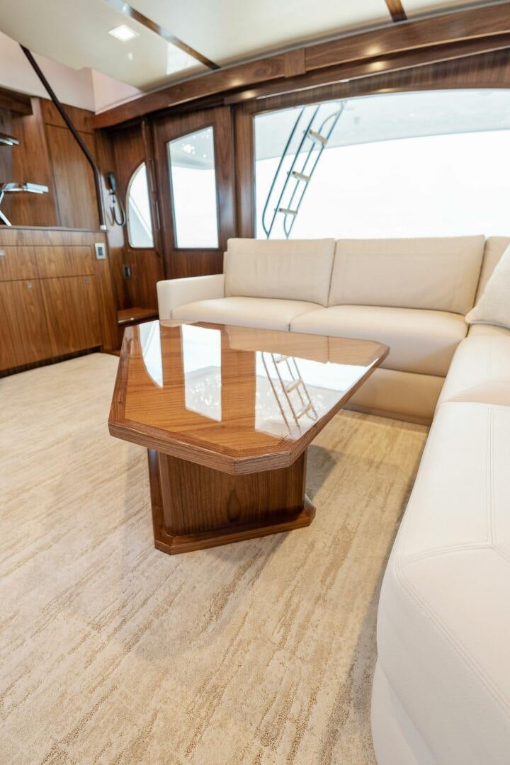 a living room with a couch and a coffee table aboard SHOE  Yacht for Sale