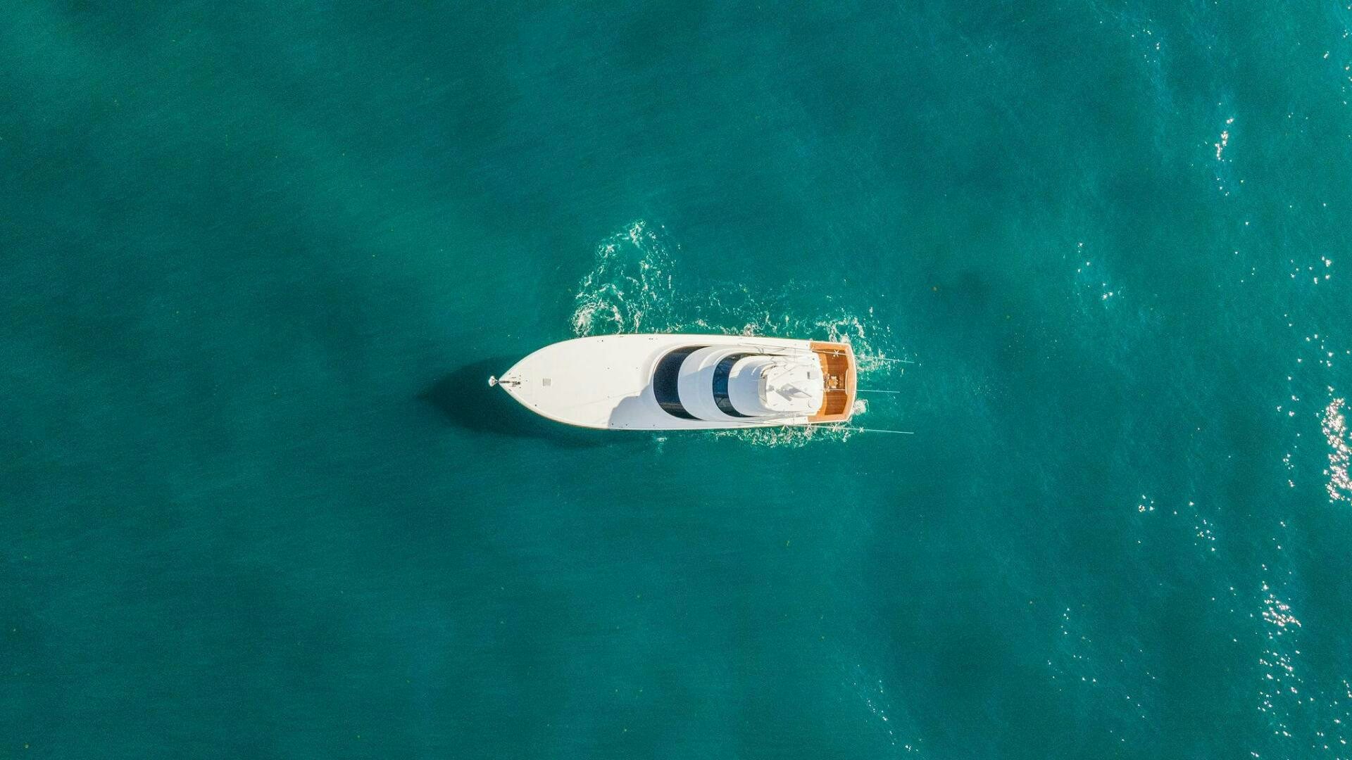 a logo on a body of water aboard SHOE  Yacht for Sale