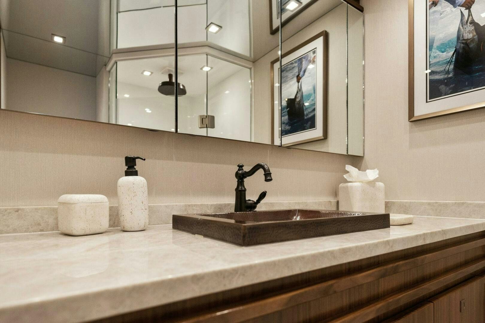 a bathroom with a sink and a mirror aboard SHOE  Yacht for Sale