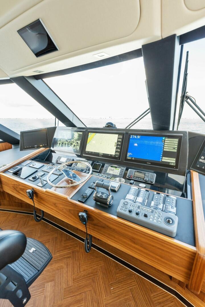 a desk with computers and monitors aboard SHOE  Yacht for Sale
