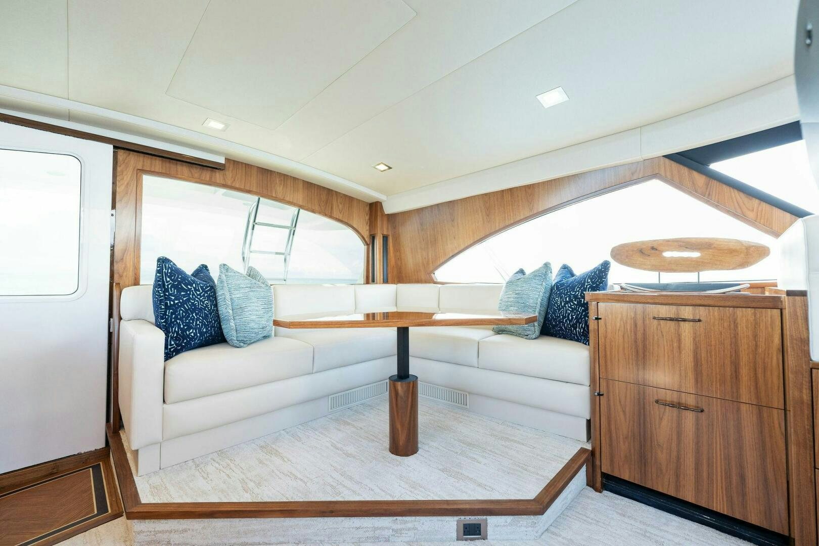 a living room with a couch and a table aboard SHOE  Yacht for Sale