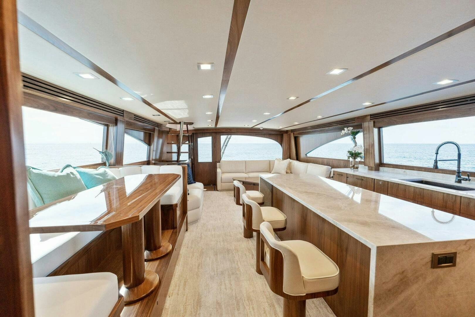 a room with a table chairs and a large window aboard SHOE  Yacht for Sale