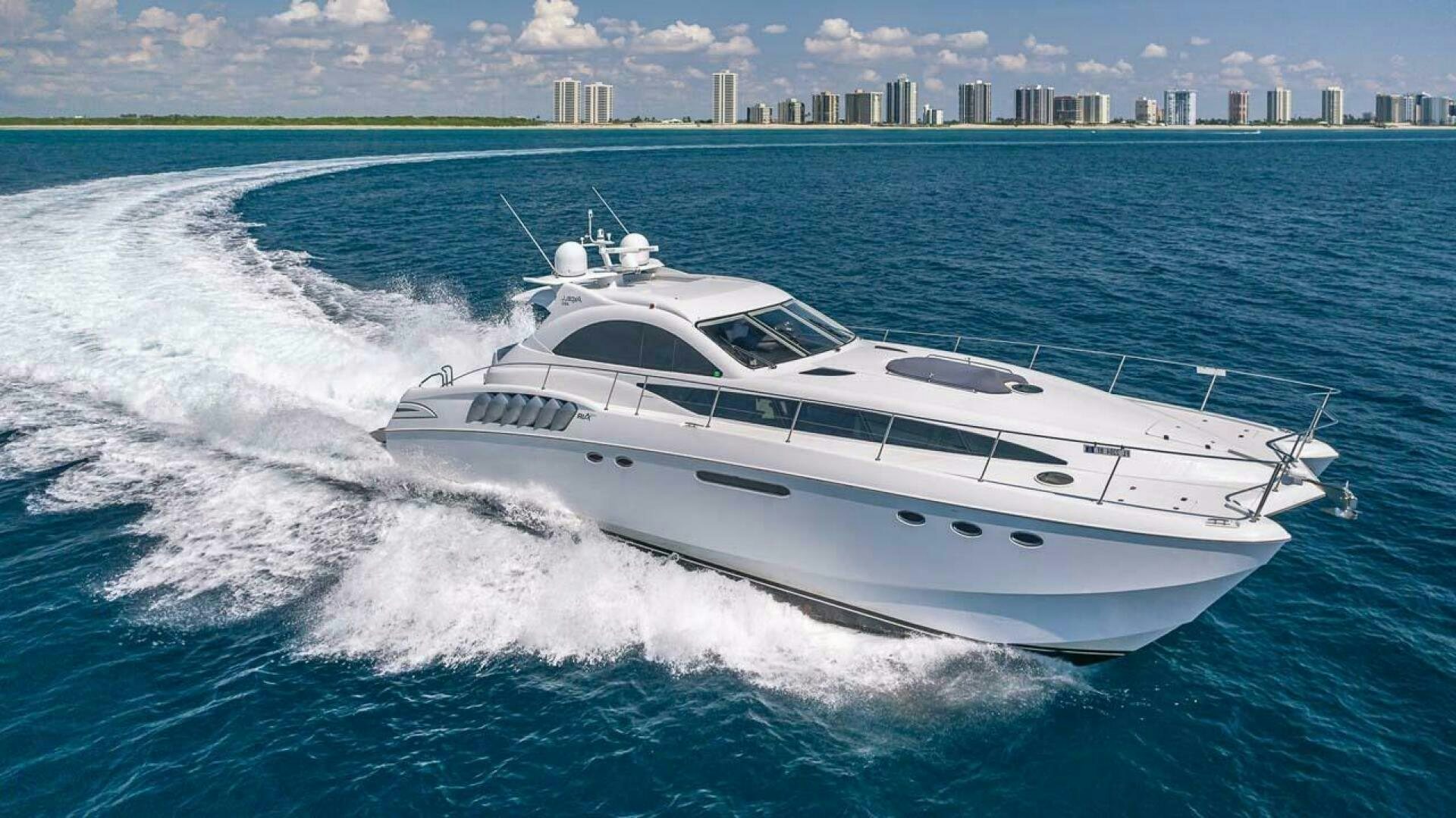 a white yacht on the water aboard AWOL SHAKA Yacht for Sale