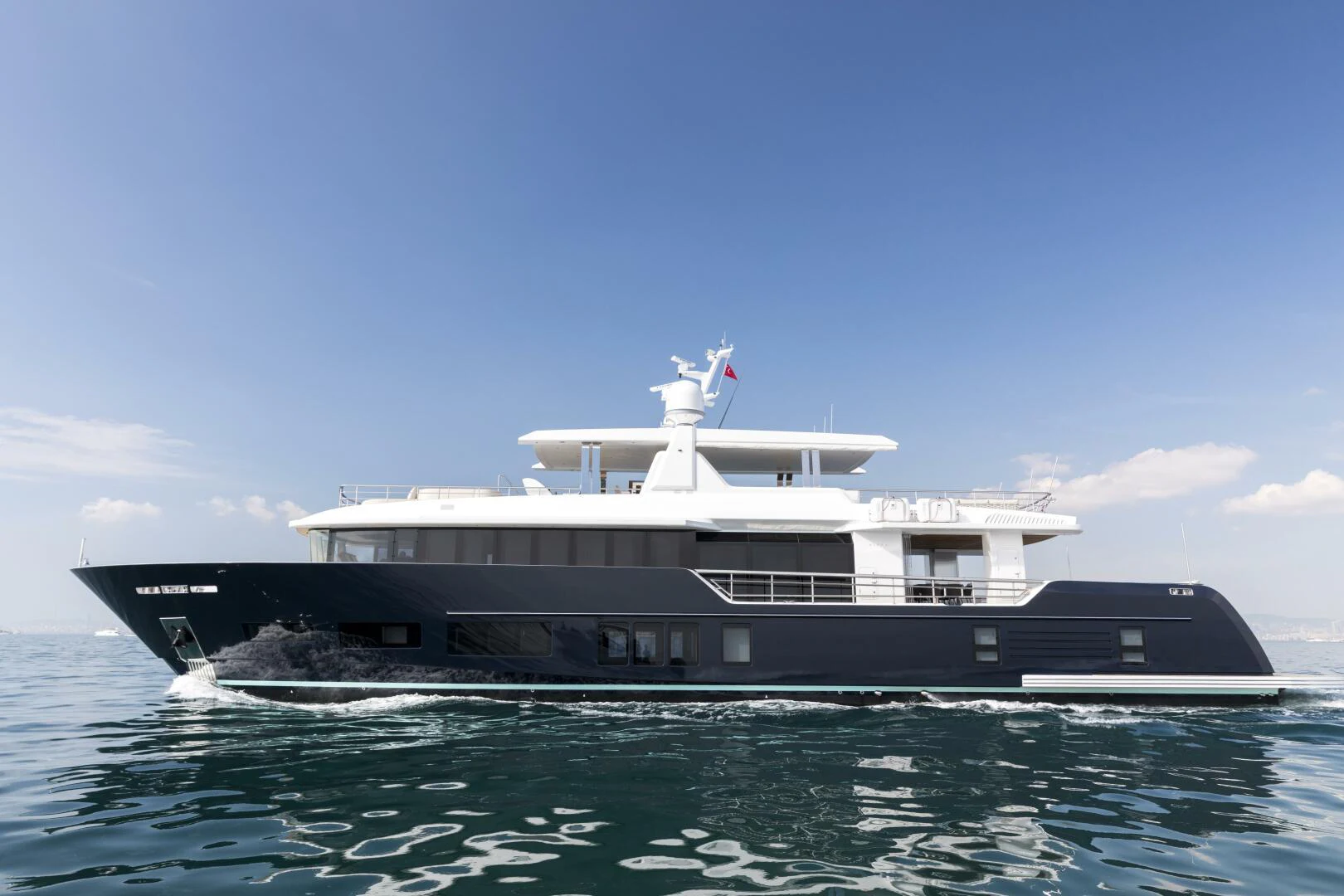 a large boat in the water aboard PICCOLO Yacht for Sale