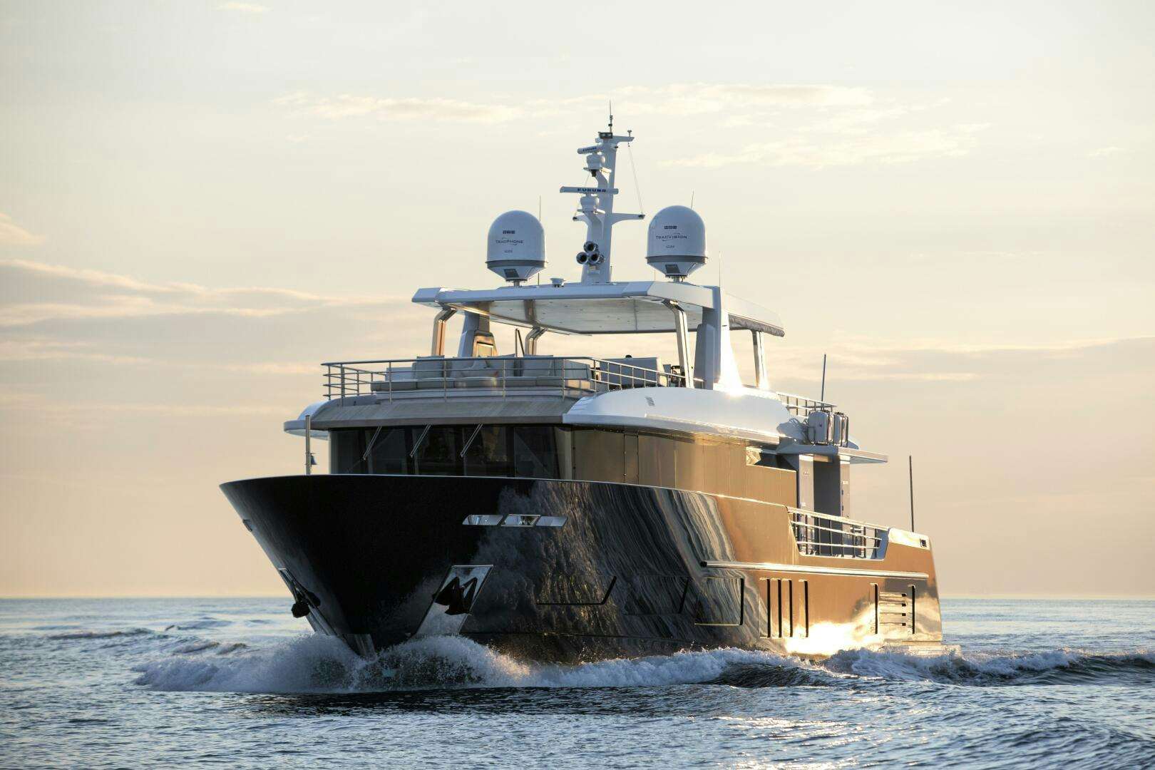 a large ship in the water aboard PICCOLO Yacht for Sale