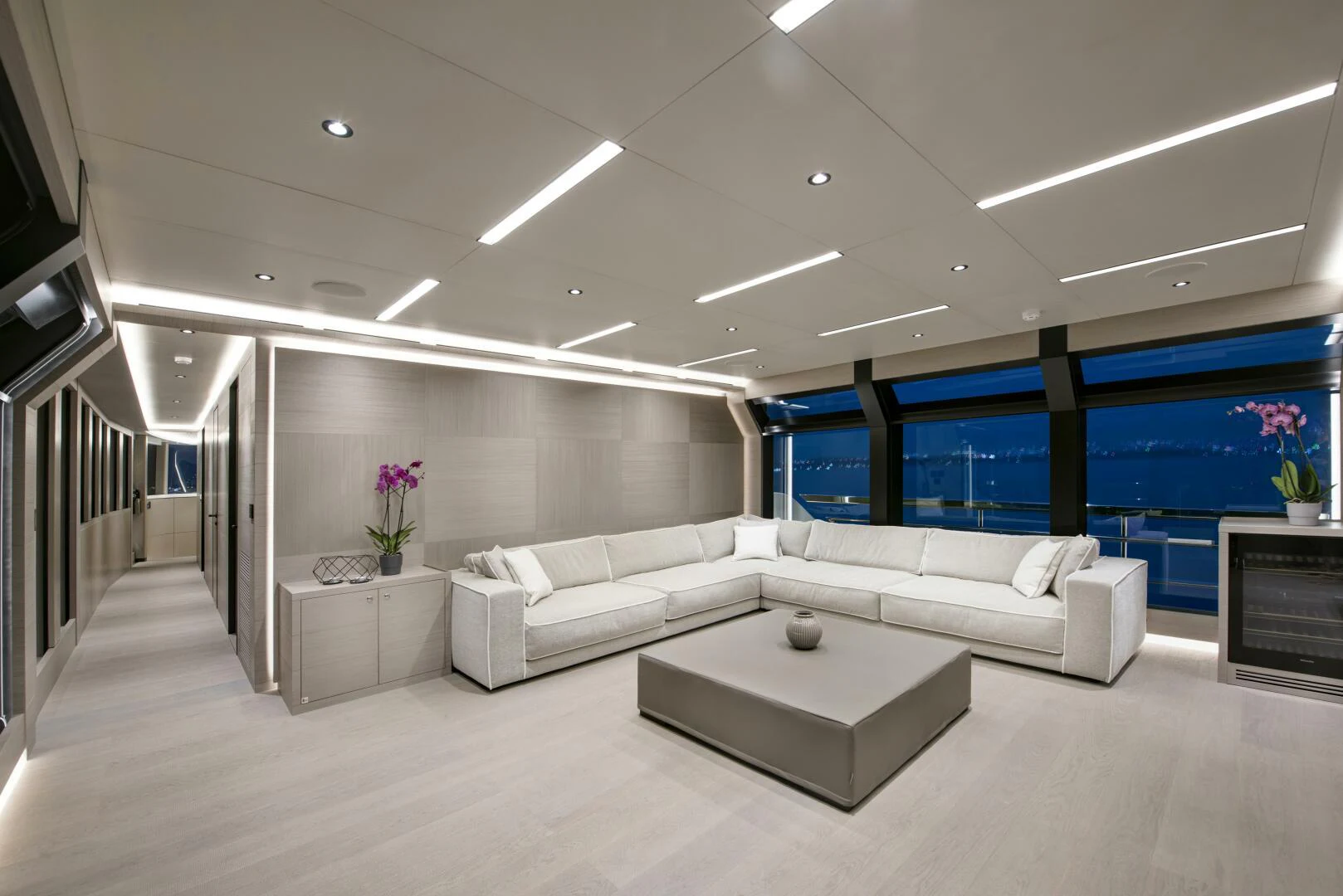 a room with white couches aboard PICCOLO Yacht for Sale