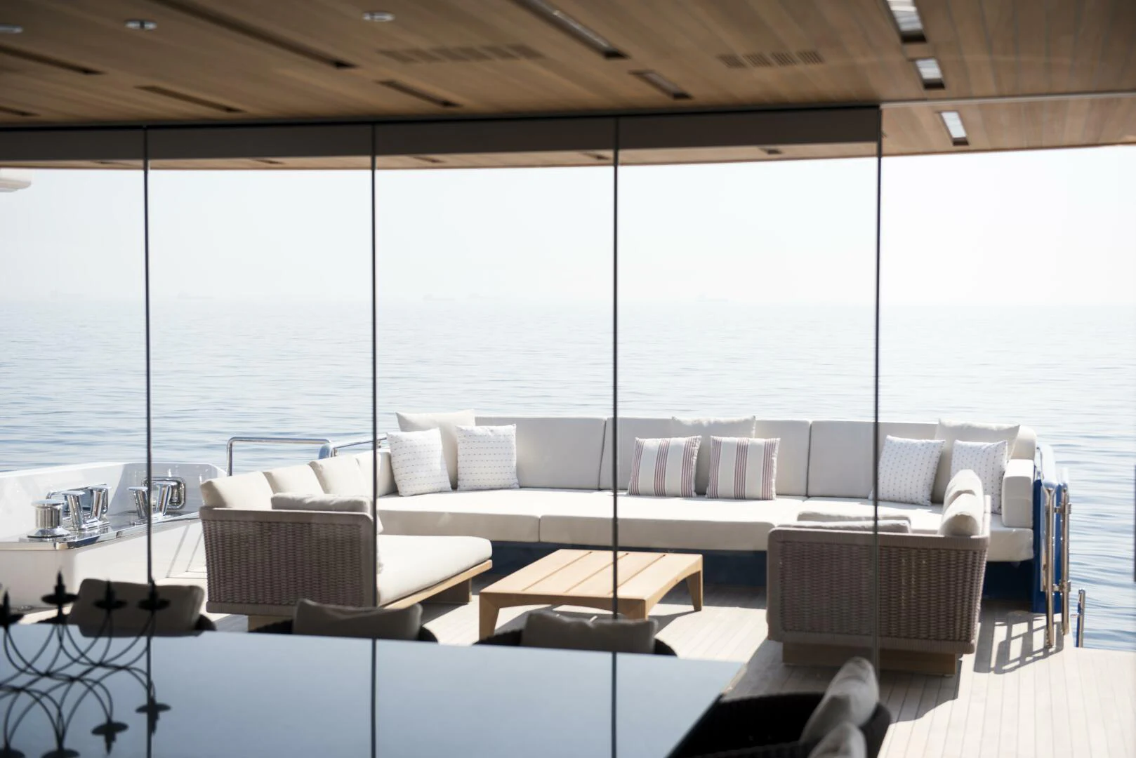 a room with a couch and a table and a large window aboard PICCOLO Yacht for Sale