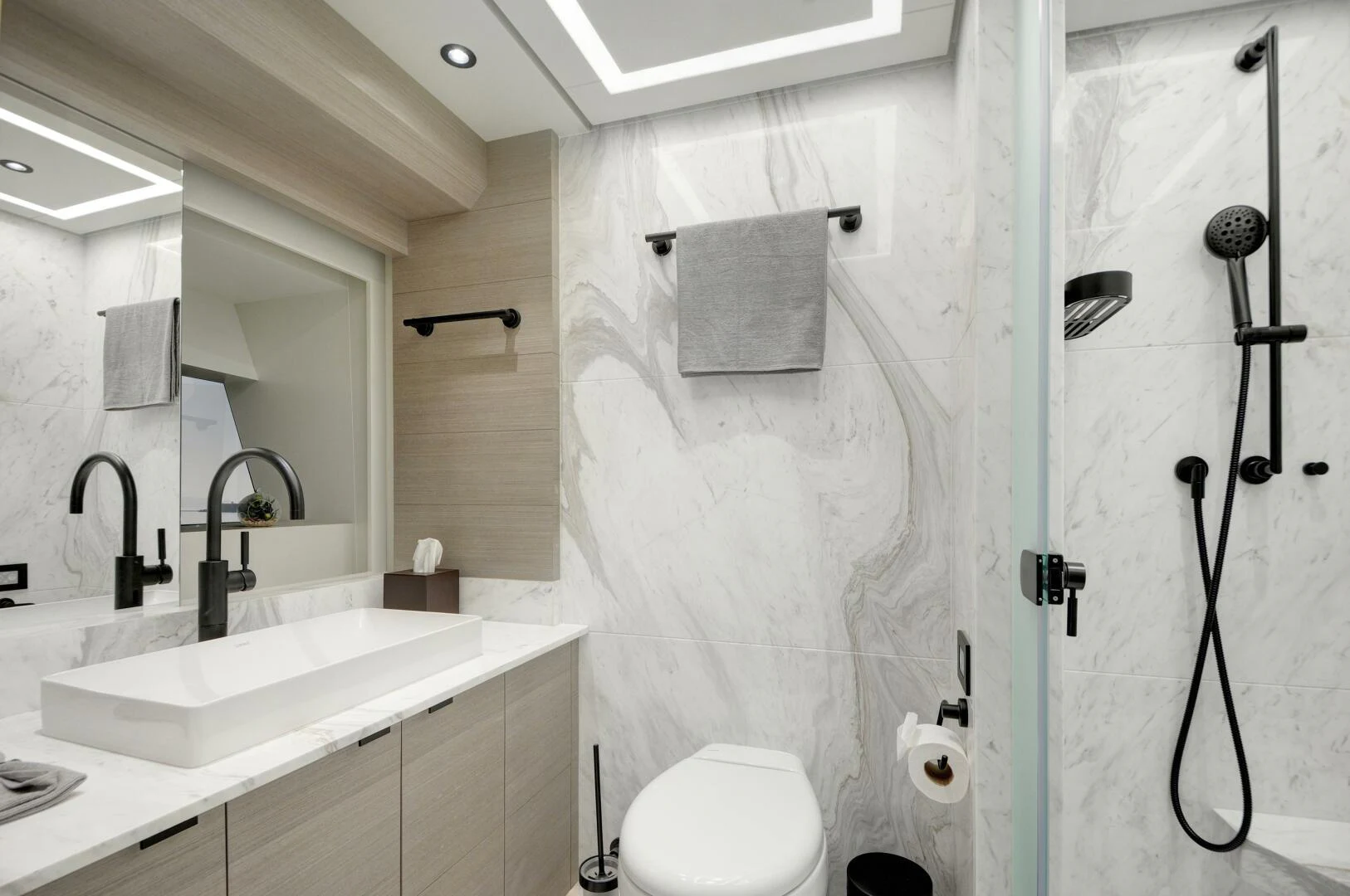 a bathroom with a shower curtain aboard PICCOLO Yacht for Sale
