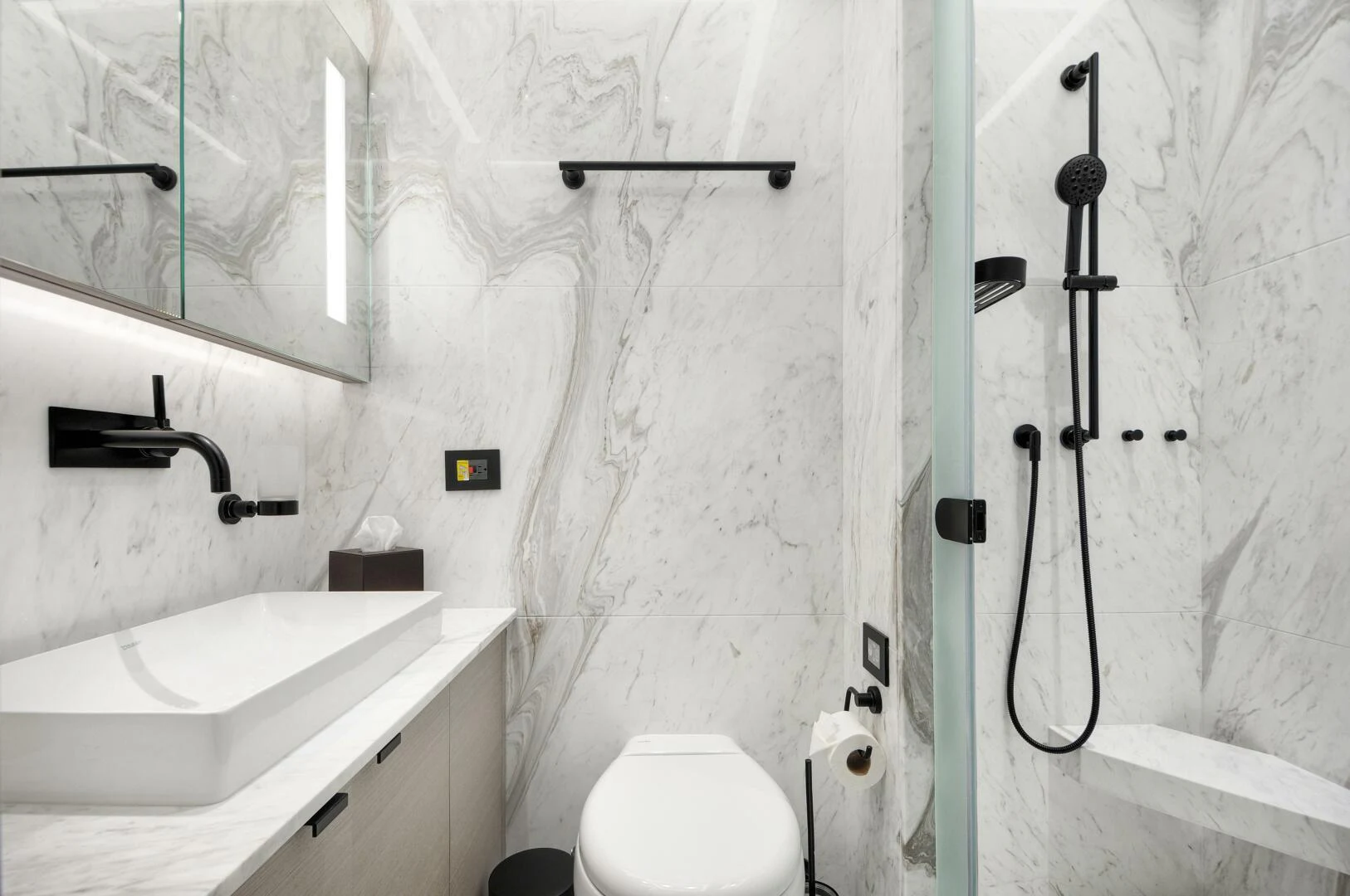 a bathroom with a sink and toilet aboard PICCOLO Yacht for Sale