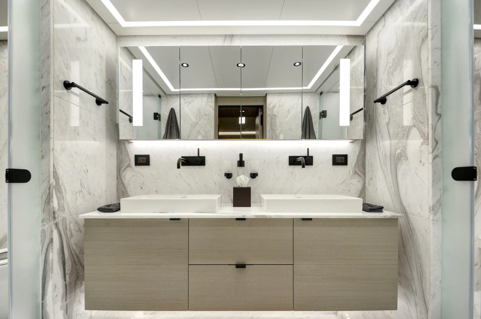 a bathroom with a sink and shower aboard PICCOLO Yacht for Sale