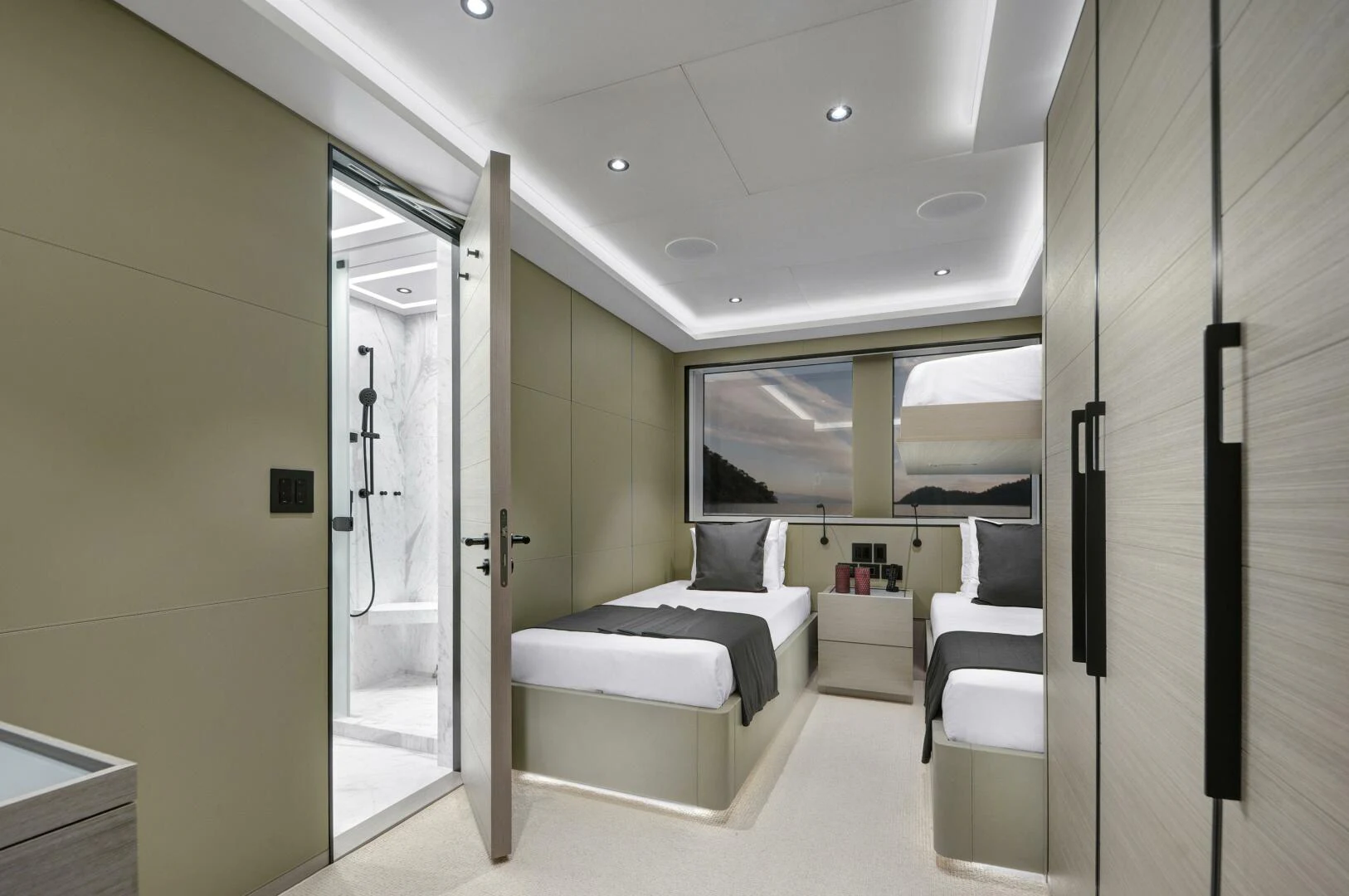 a room with a bed and a desk aboard PICCOLO Yacht for Sale