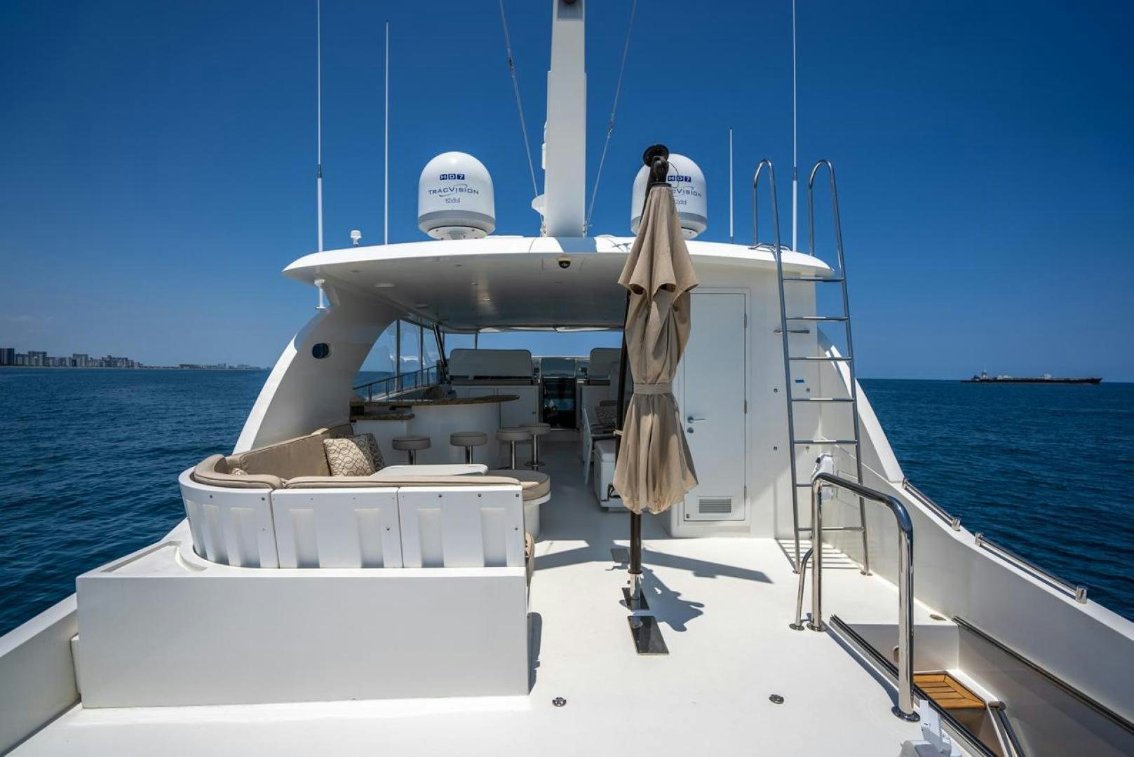 a boat with a person standing on the deck aboard AMERICAN HONEY Yacht for Sale