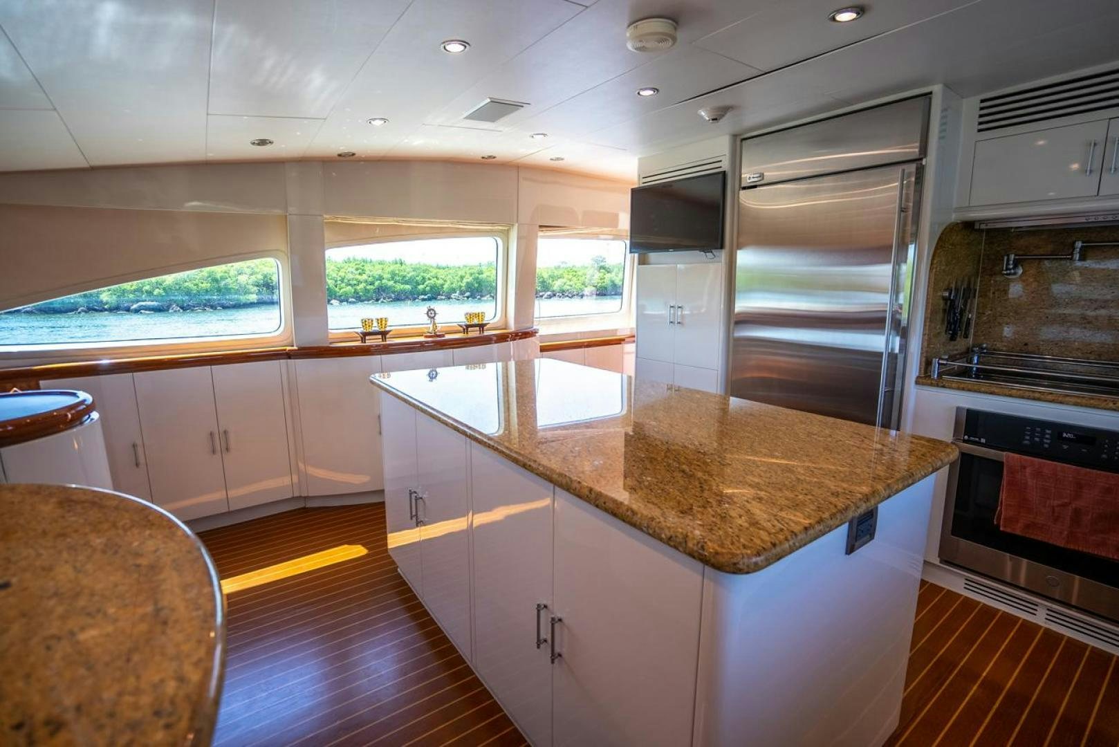 a kitchen with a large island aboard AMERICAN HONEY Yacht for Sale
