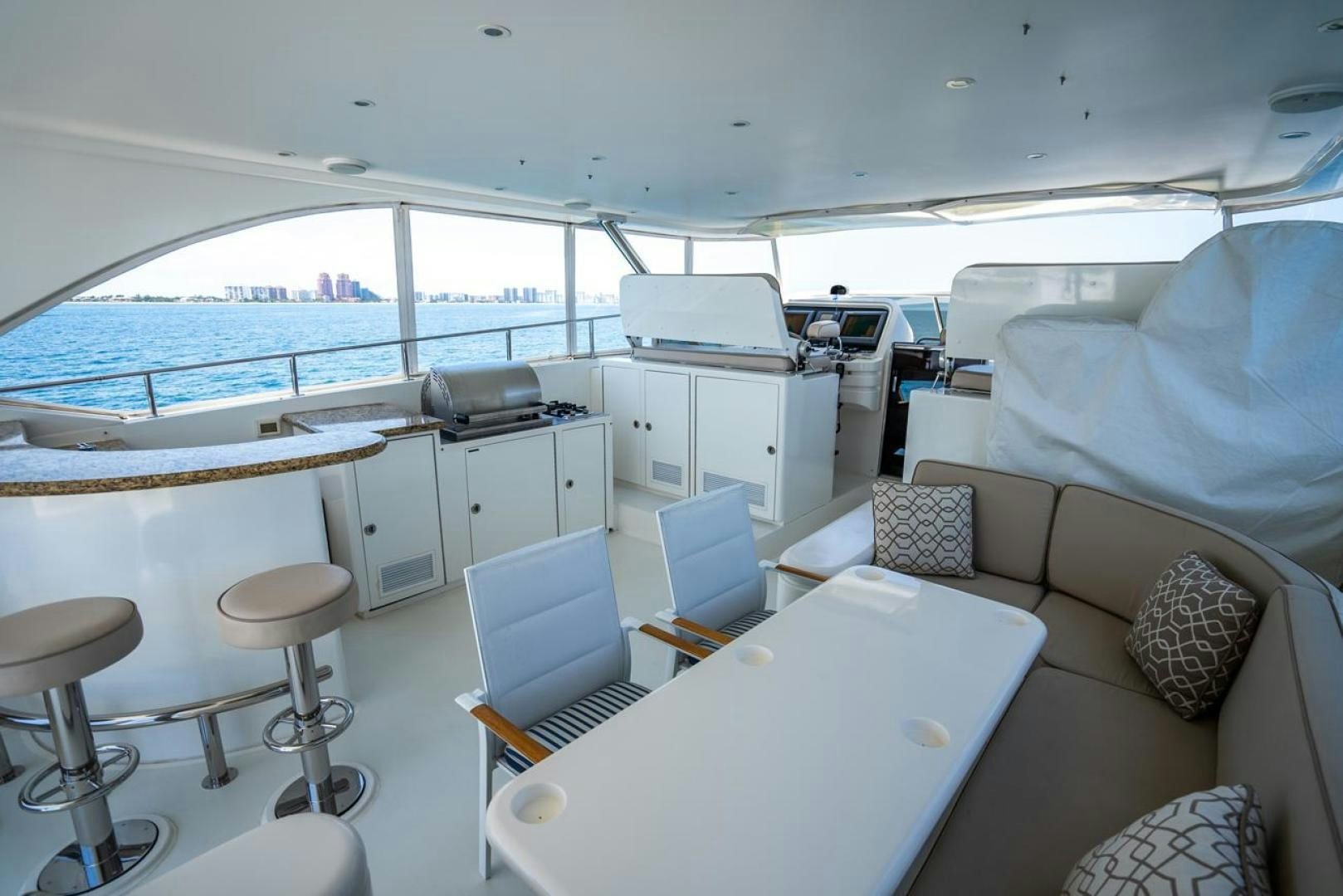 a boat with a table and chairs aboard AMERICAN HONEY Yacht for Sale