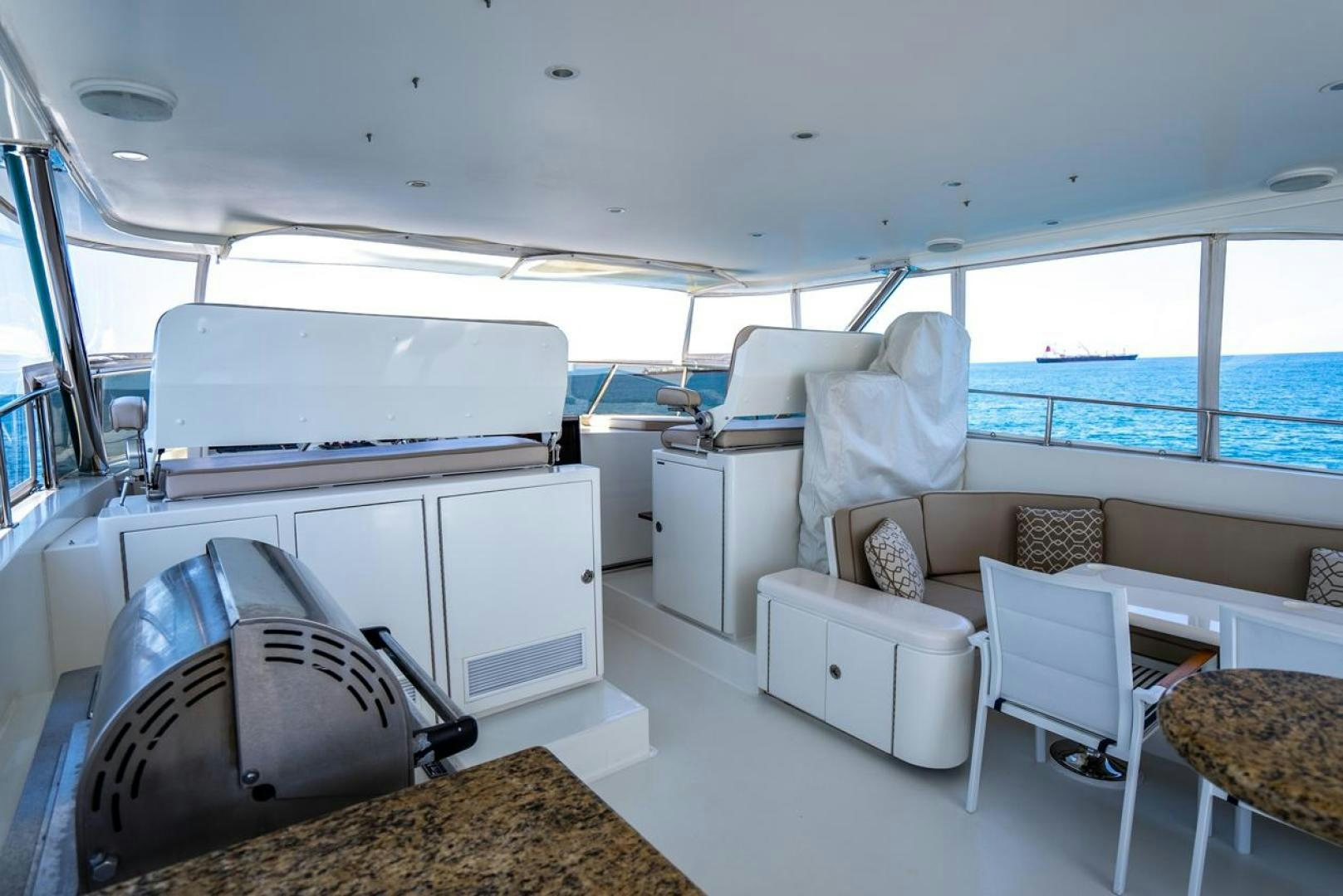 a room with a couch and a table and a chair aboard AMERICAN HONEY Yacht for Sale
