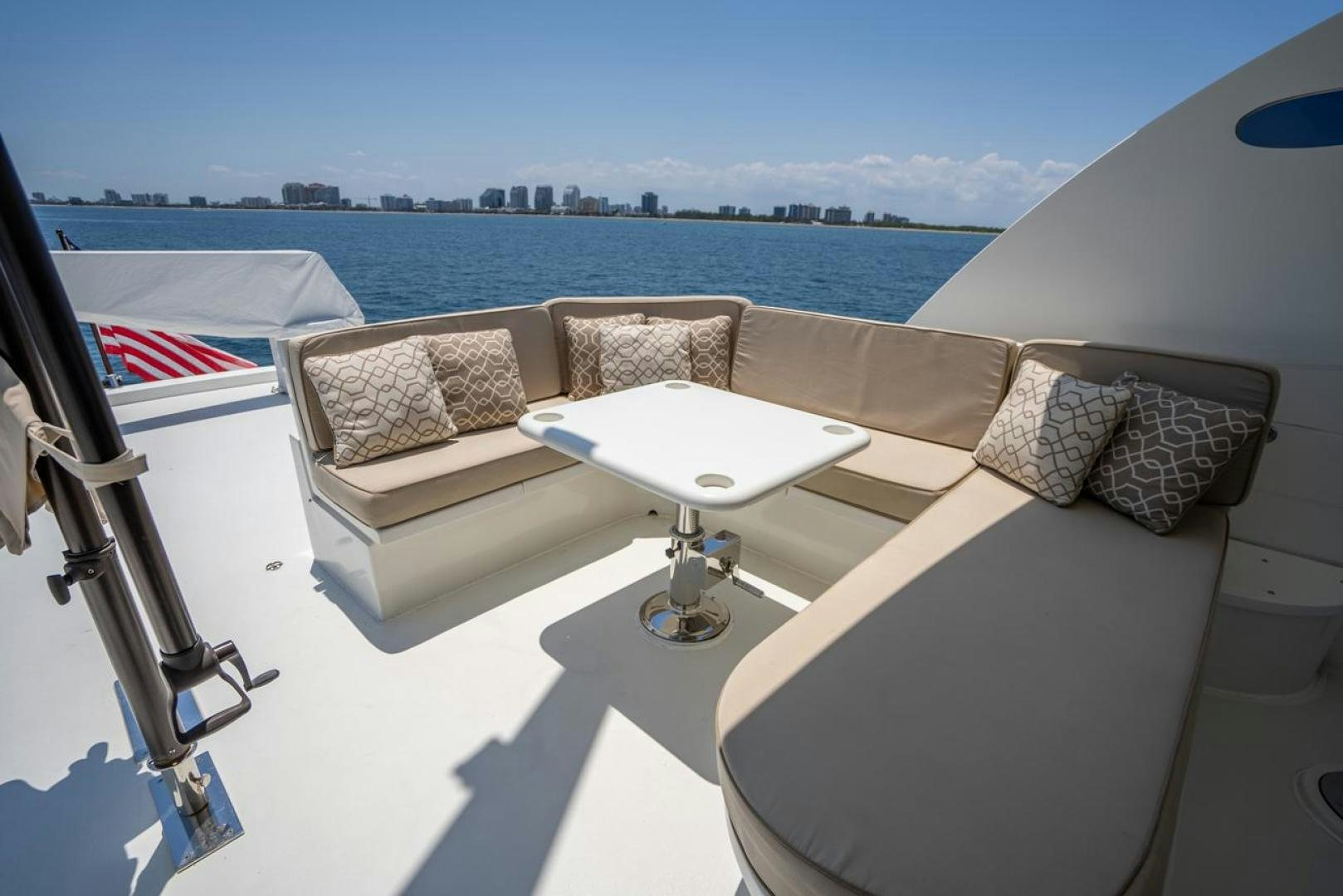 a room with couches and a table and chairs aboard AMERICAN HONEY Yacht for Sale
