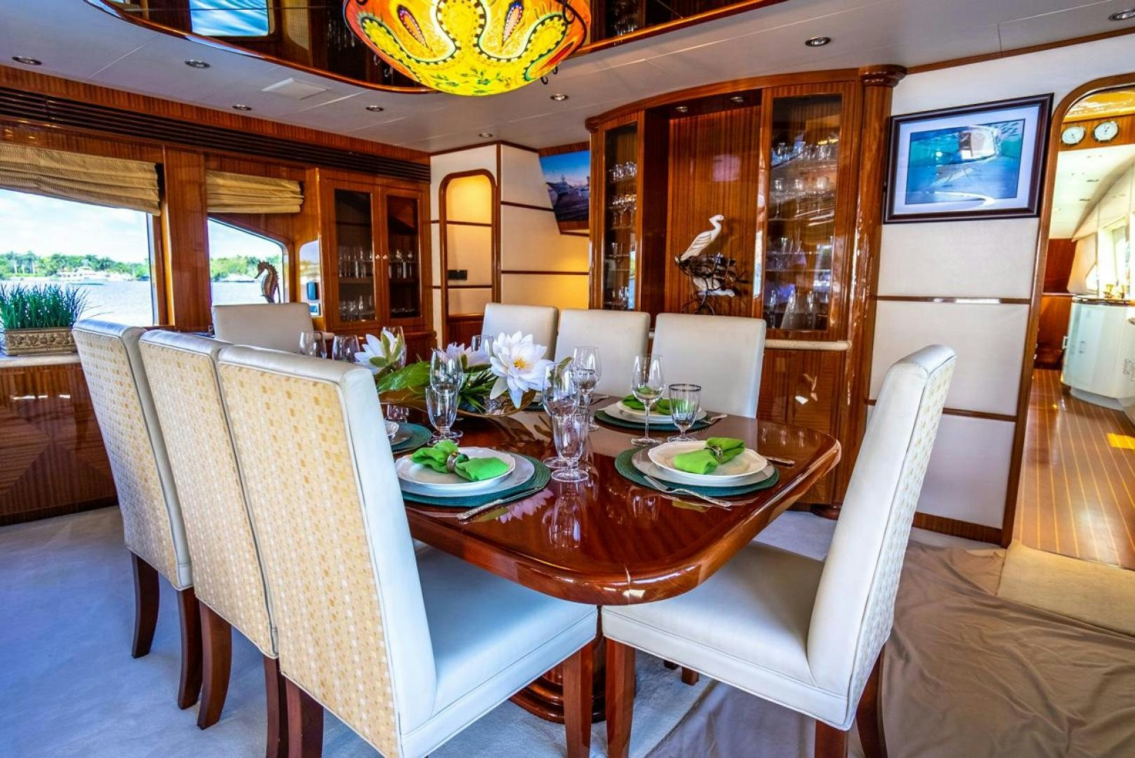a dining room with a table set aboard AMERICAN HONEY Yacht for Sale