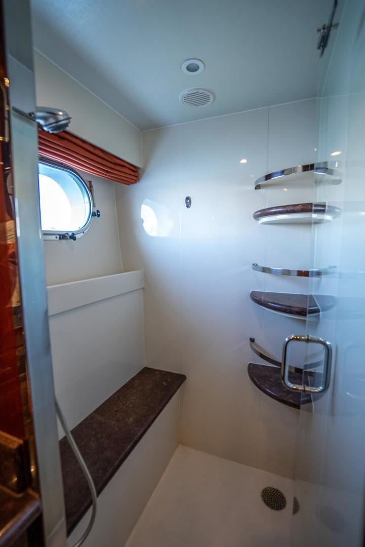a bathroom with a sink and a mirror aboard AMERICAN HONEY Yacht for Sale