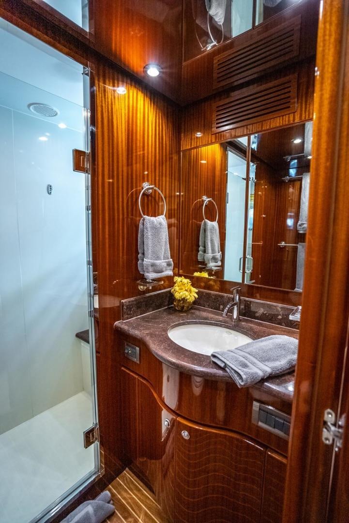 a bathroom with a sink and mirror aboard AMERICAN HONEY Yacht for Sale