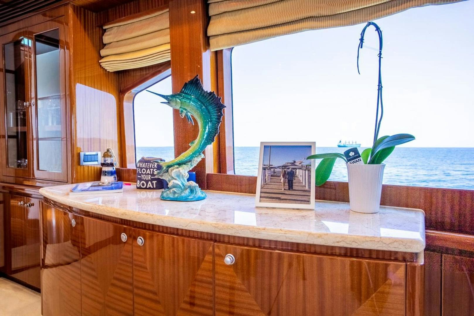 a counter top with a vase and a plant on it aboard AMERICAN HONEY Yacht for Sale