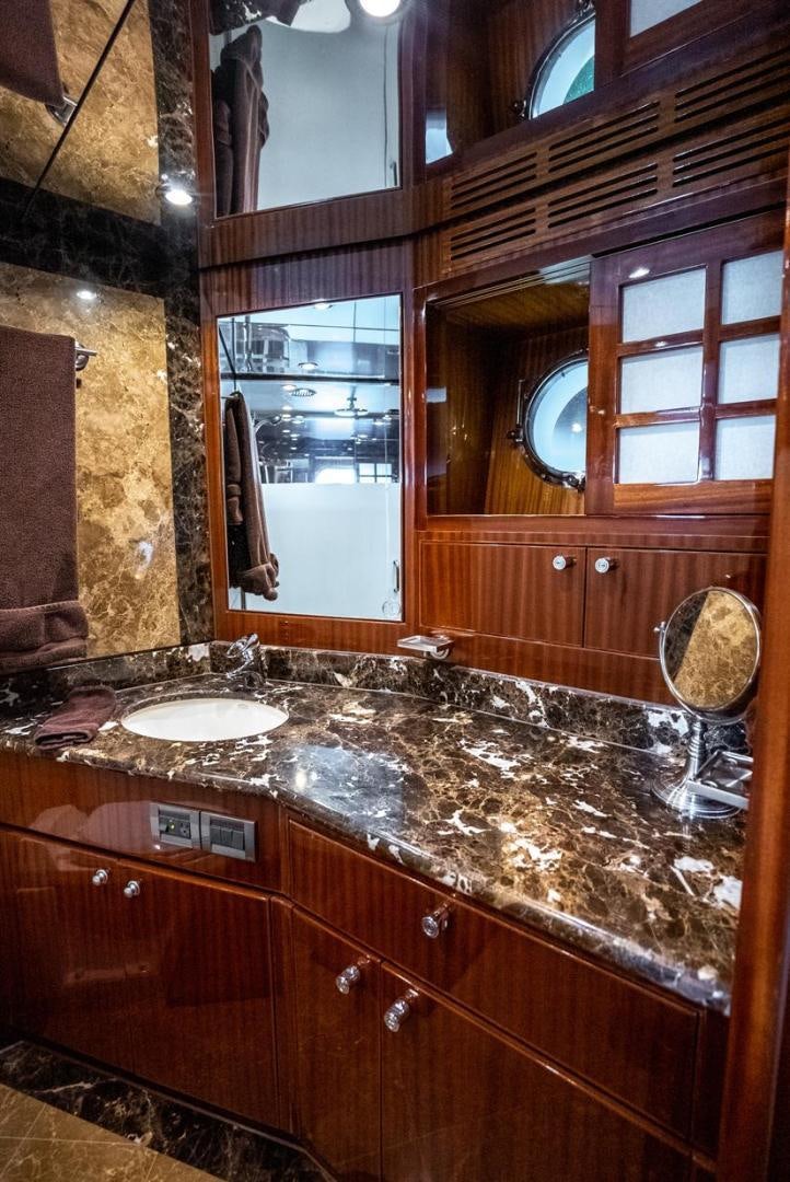 a bathroom with a marble counter top aboard AMERICAN HONEY Yacht for Sale