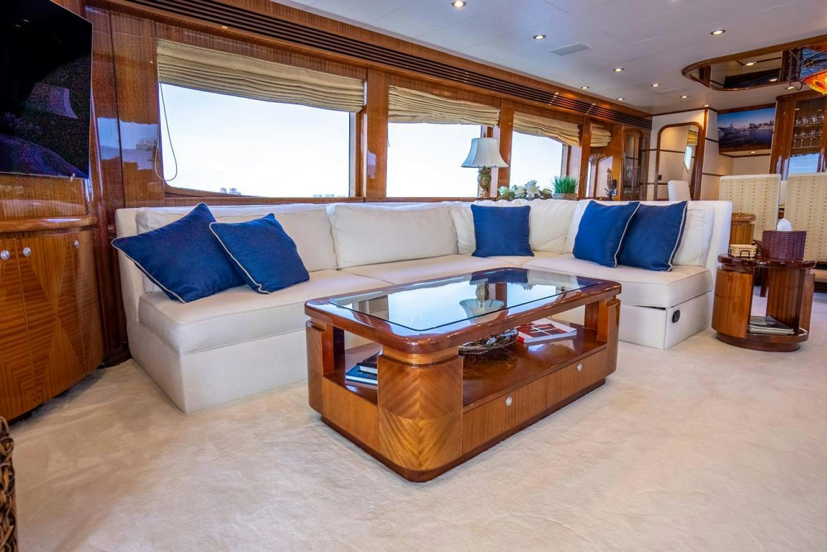 a living room with a couch and a coffee table aboard AMERICAN HONEY Yacht for Sale