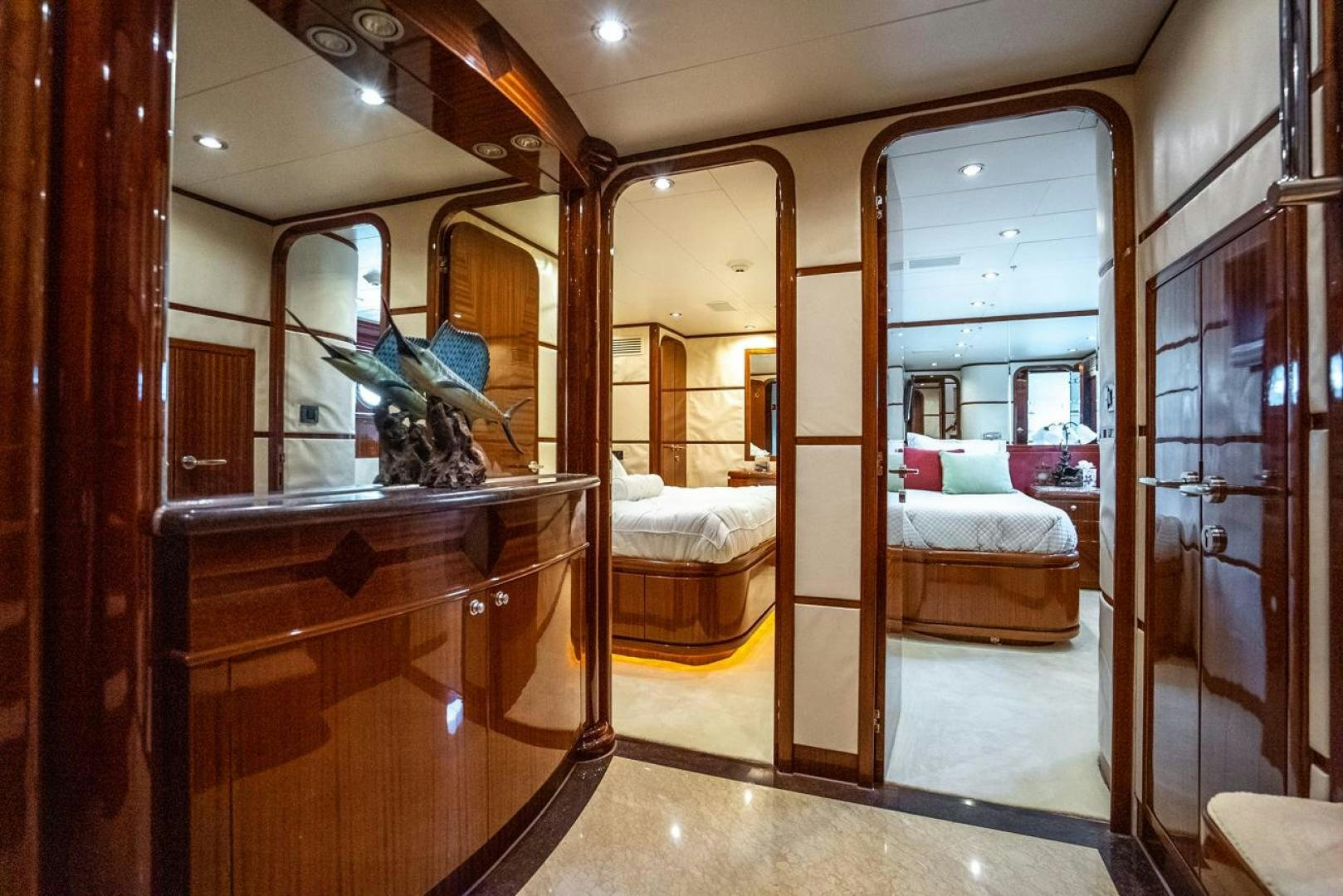 a bedroom with a large mirror aboard AMERICAN HONEY Yacht for Sale