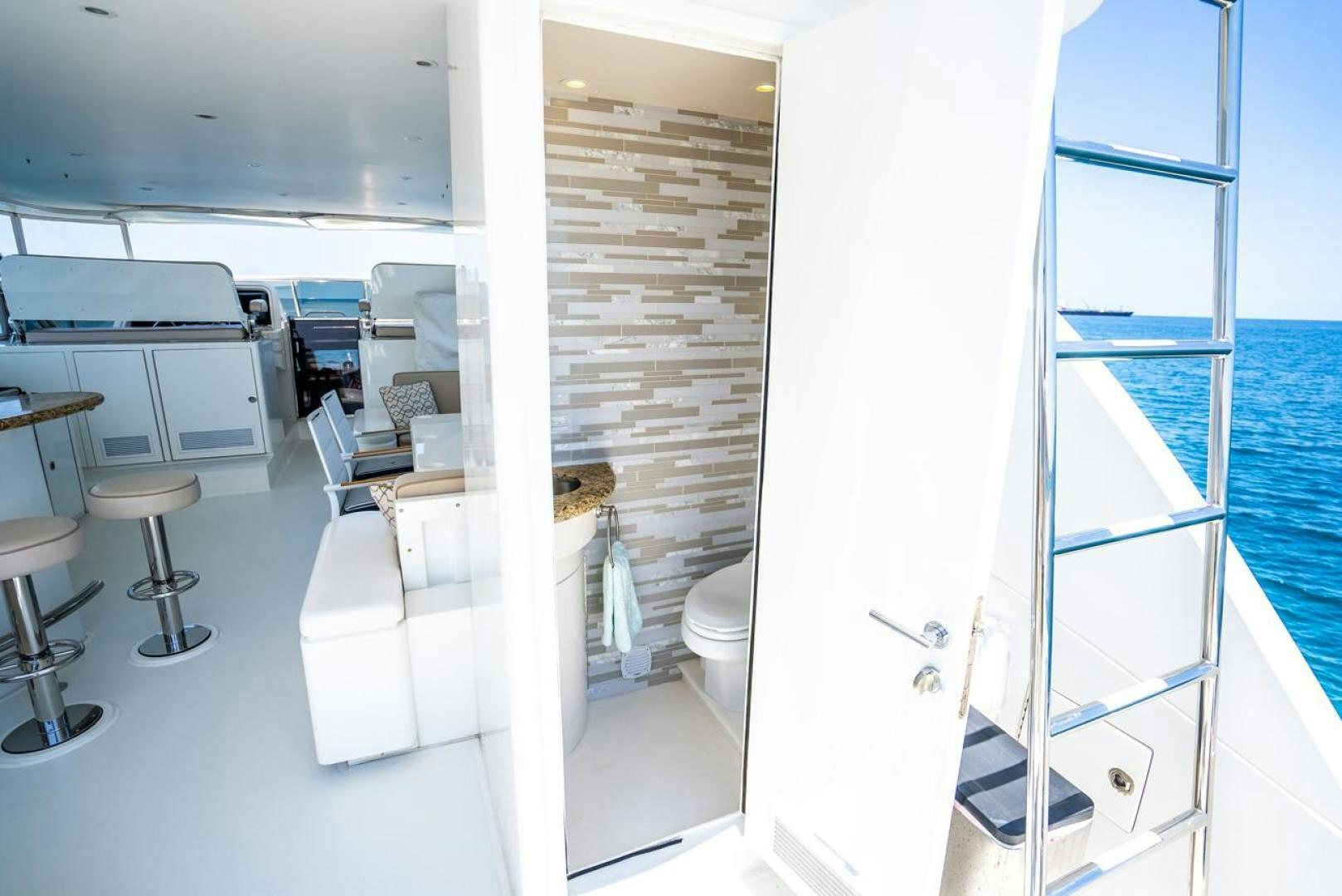 a bathroom with a glass shower aboard AMERICAN HONEY Yacht for Sale