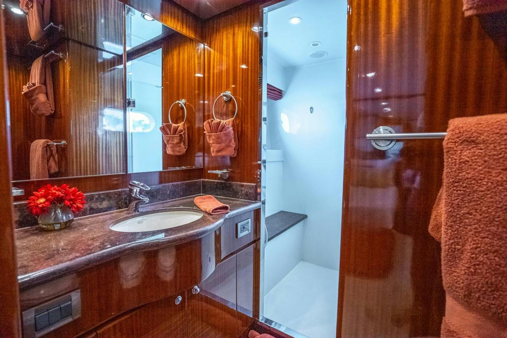 a bathroom with a sink and a mirror aboard AMERICAN HONEY Yacht for Sale