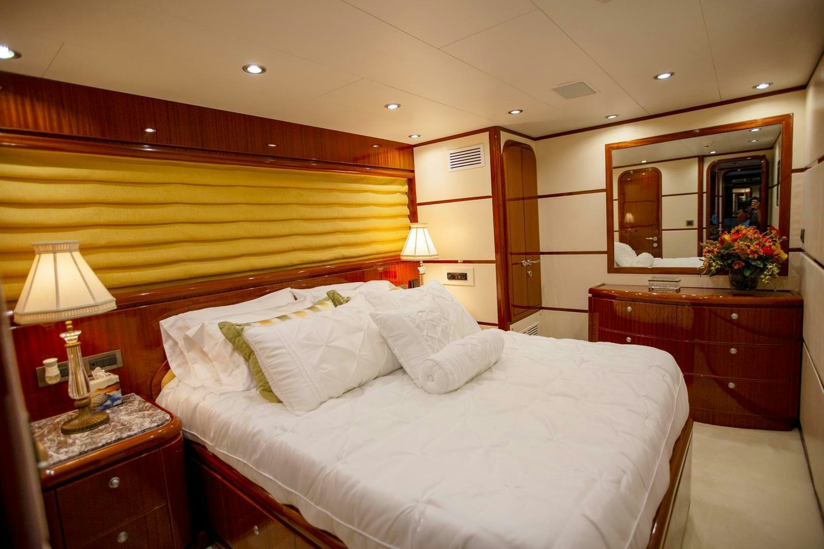 a bedroom with a bed and a desk aboard AMERICAN HONEY Yacht for Sale