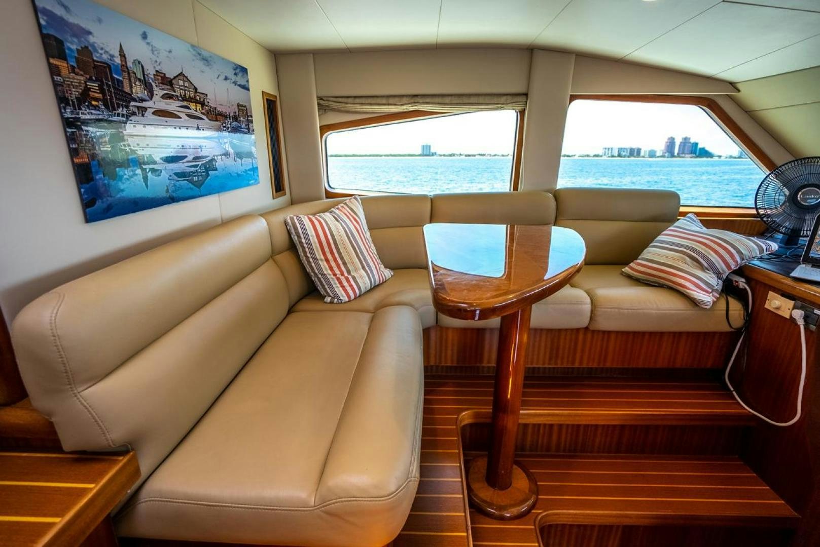 a living room with a couch and a table aboard AMERICAN HONEY Yacht for Sale