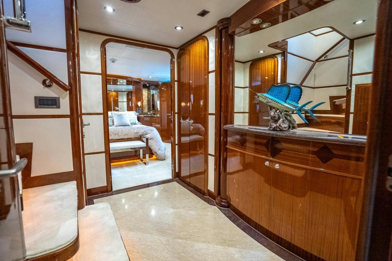 a room with a bed and a mirror aboard AMERICAN HONEY Yacht for Sale