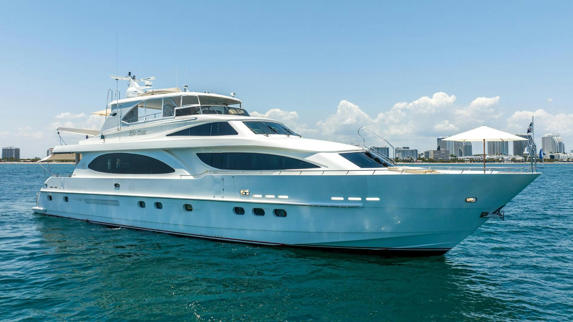 a white yacht in the water aboard AMERICAN HONEY Yacht for Sale