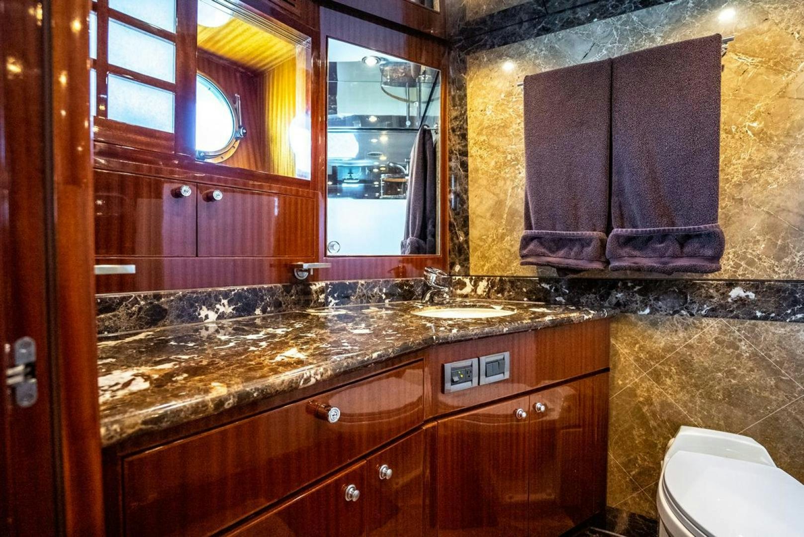 a bathroom with a large mirror aboard AMERICAN HONEY Yacht for Sale