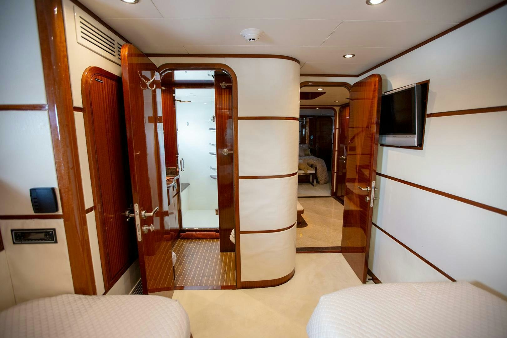 a room with a bed and a television aboard AMERICAN HONEY Yacht for Sale