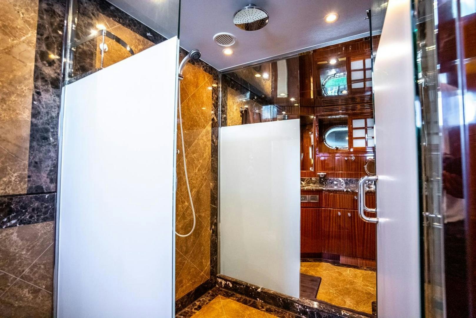 a room with a door and a mirror aboard AMERICAN HONEY Yacht for Sale