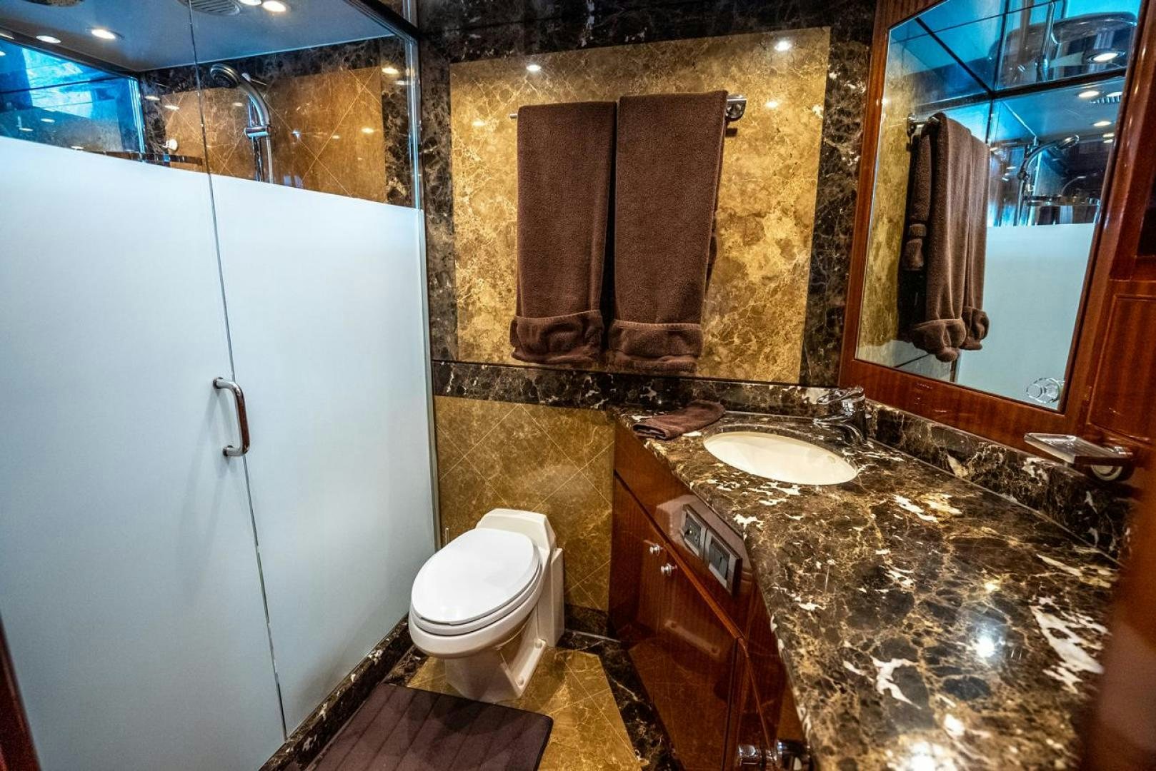 a bathroom with marble counter tops aboard AMERICAN HONEY Yacht for Sale