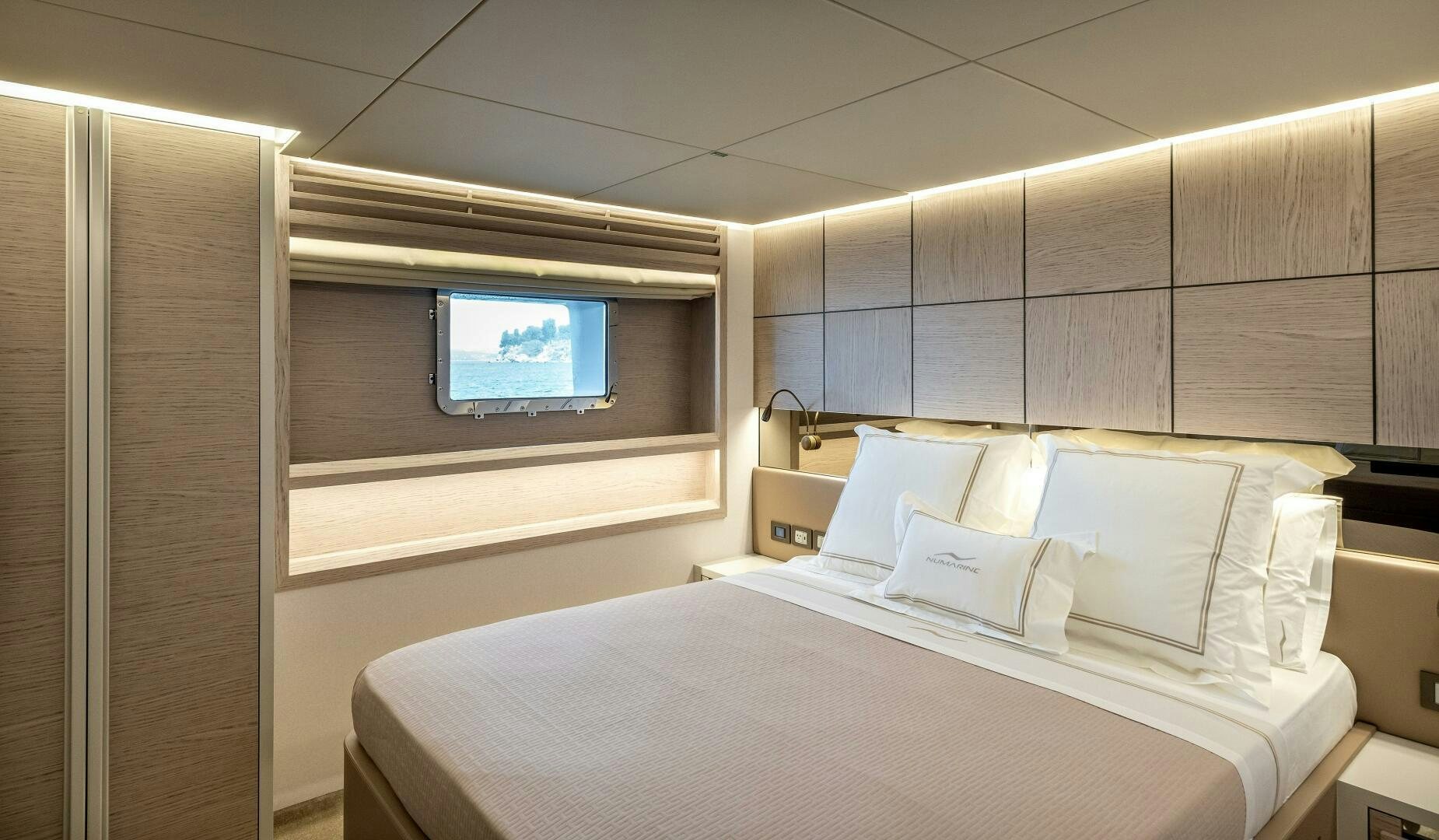 a room with a bed and a television aboard 37XP 08 ROCKIT Yacht for Sale