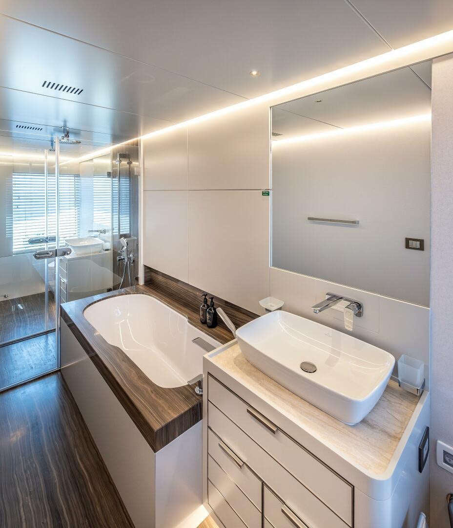 a bathroom with a large mirror aboard 37XP 08 ROCKIT Yacht for Sale