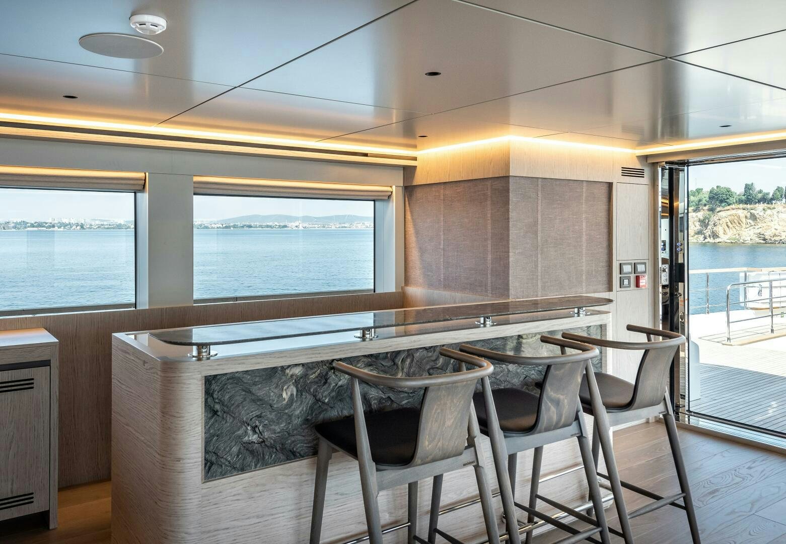 a kitchen with a table and chairs aboard 37XP 08 ROCKIT Yacht for Sale