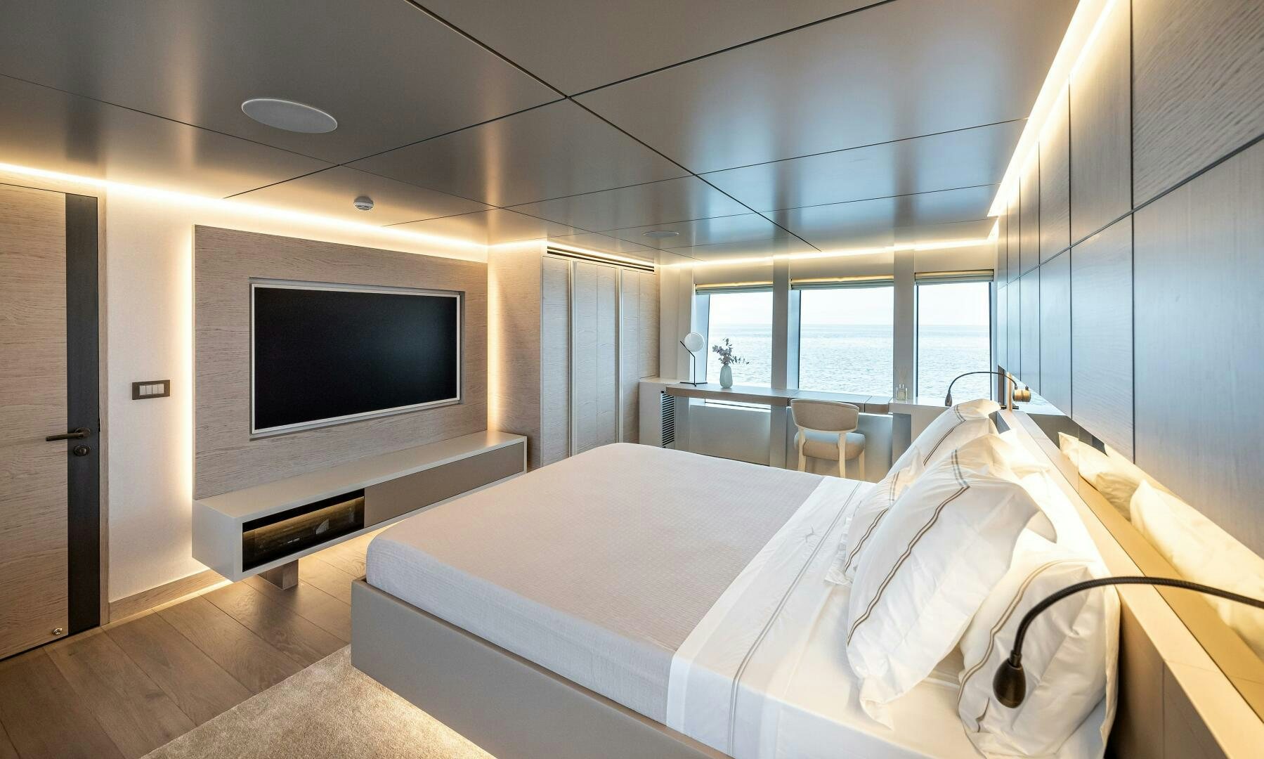a room with a bed and a tv aboard 37XP 08 ROCKIT Yacht for Sale