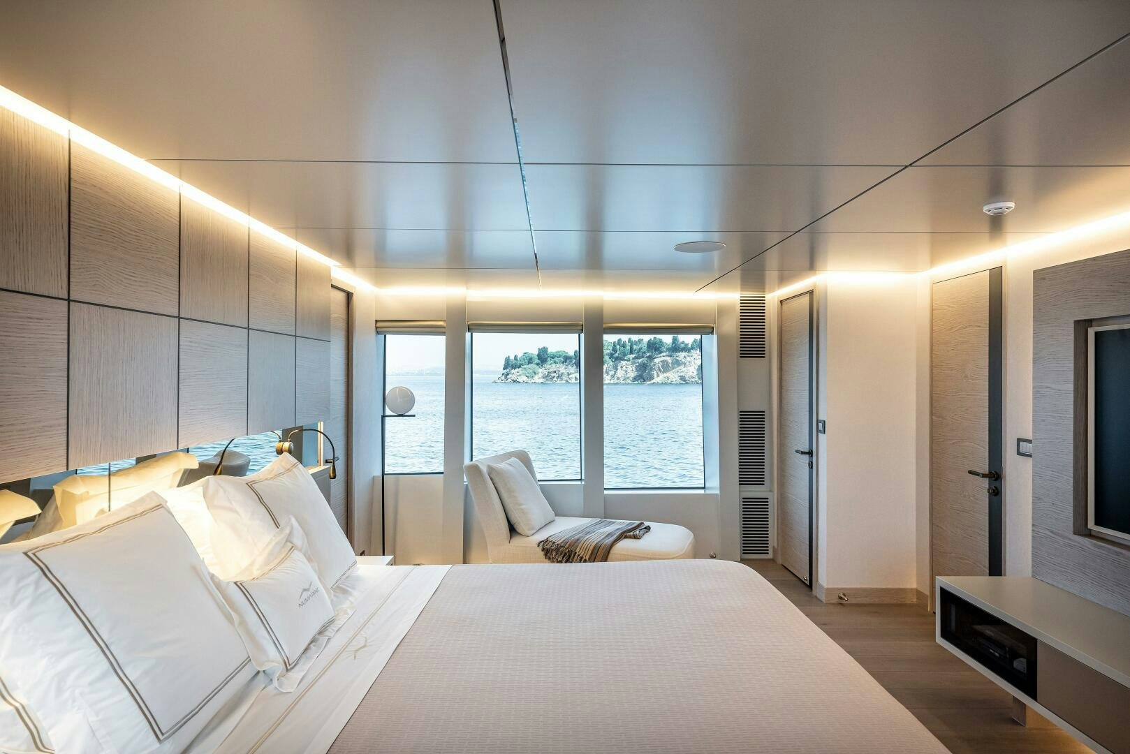 a bedroom with a large window aboard 37XP 08 ROCKIT Yacht for Sale