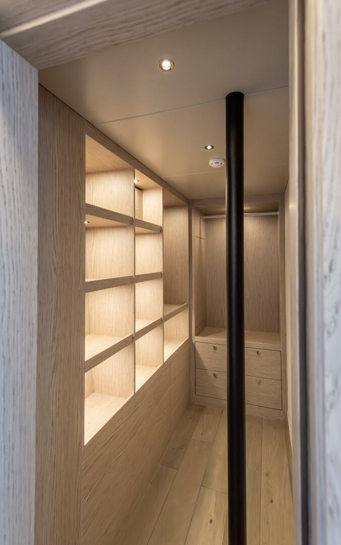 a wooden bathroom with a large black pole aboard 37XP 08 ROCKIT Yacht for Sale