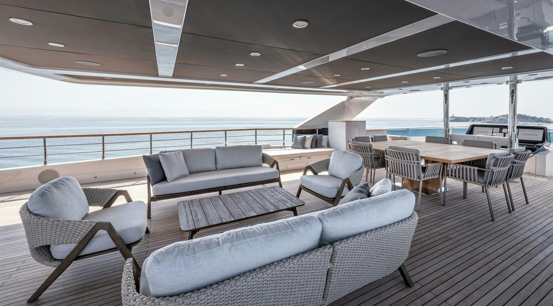 a room with a couch and a table and chairs aboard 37XP 08 ROCKIT Yacht for Sale