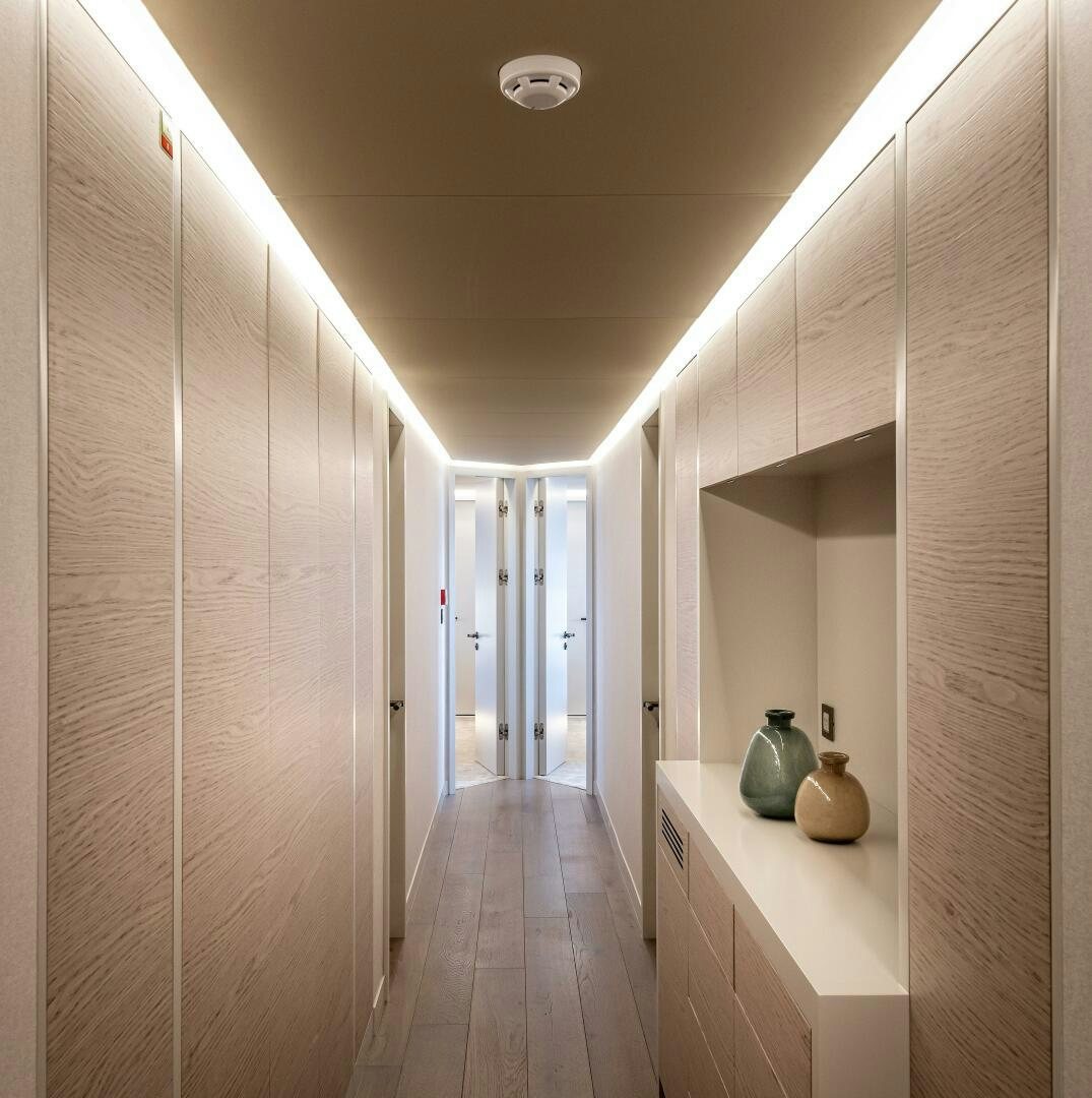 a hallway with white walls aboard 37XP 08 ROCKIT Yacht for Sale