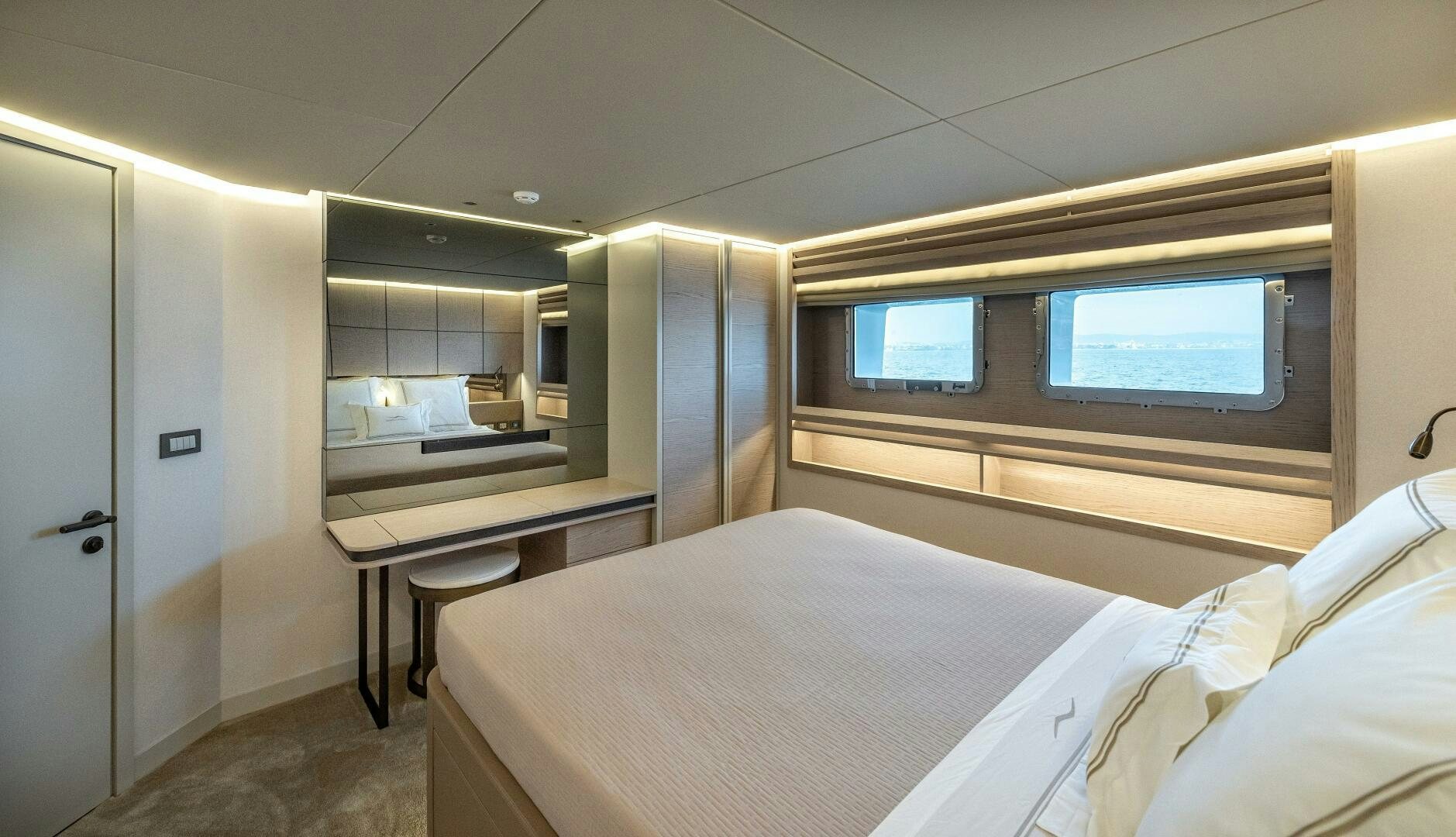 a room with a bed and desk aboard 37XP 08 ROCKIT Yacht for Sale