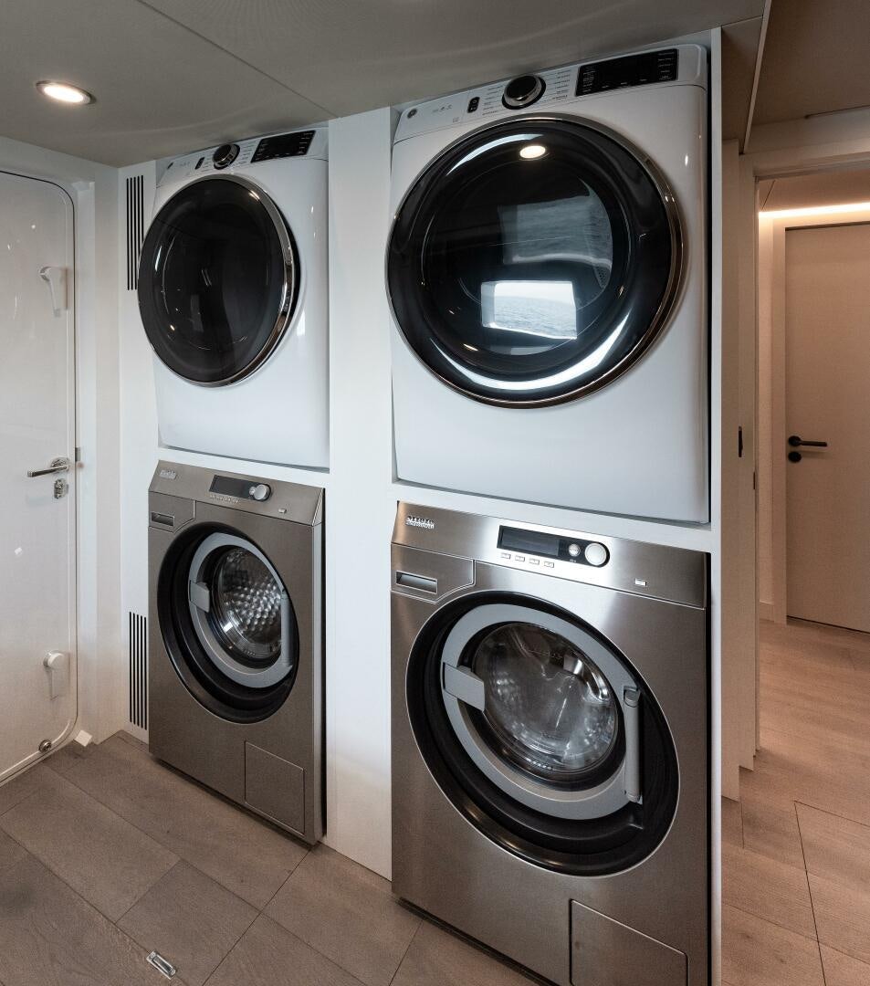 a row of washers in a room aboard 37XP 08 ROCKIT Yacht for Sale